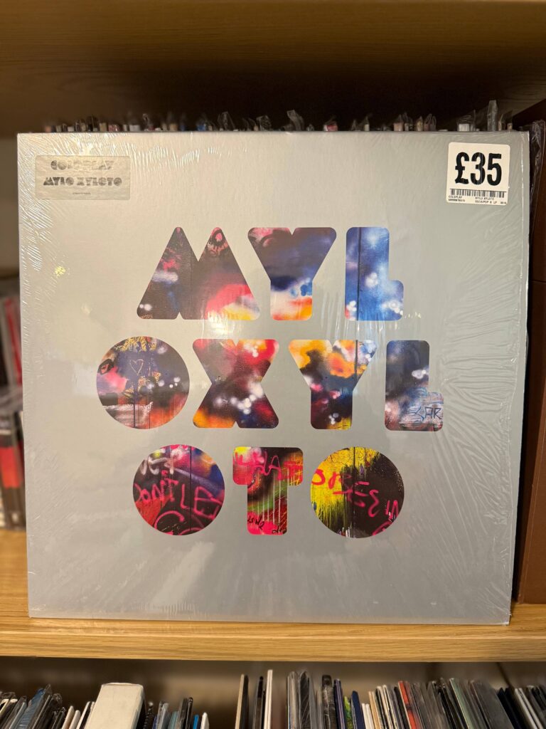 Coldplay - Mylo Xyloto vinyl record with graffiti-style artwork