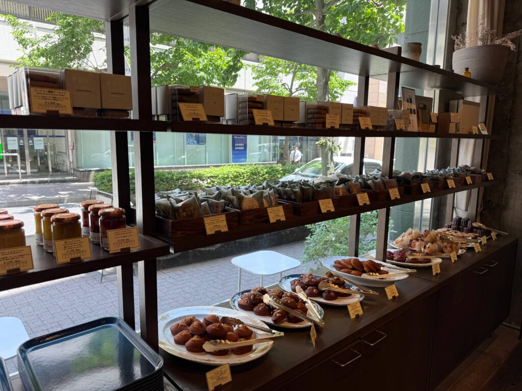 Baked goods corner inside Patisserie ease with various sweets on display shelves