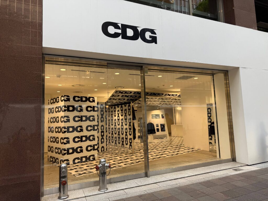 CDG store exterior glass facade and CDG logo