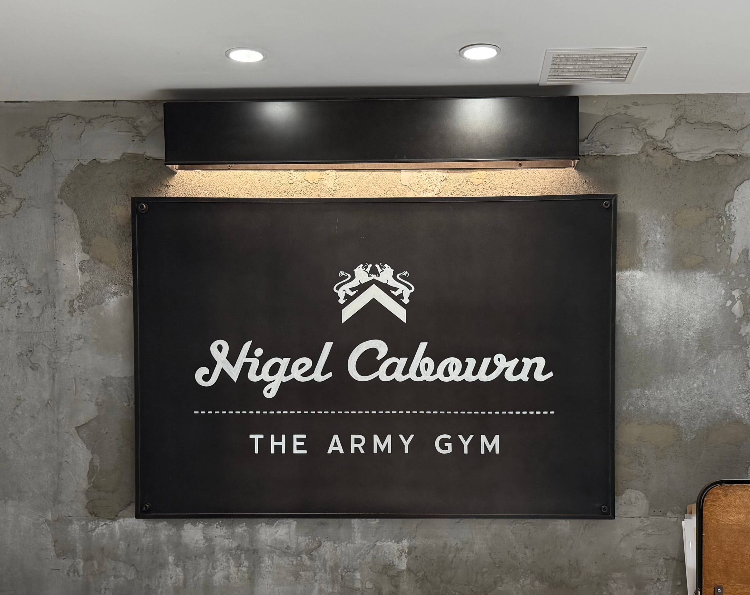 Nigel Cabourn THE ARMY GYM brand logo sign