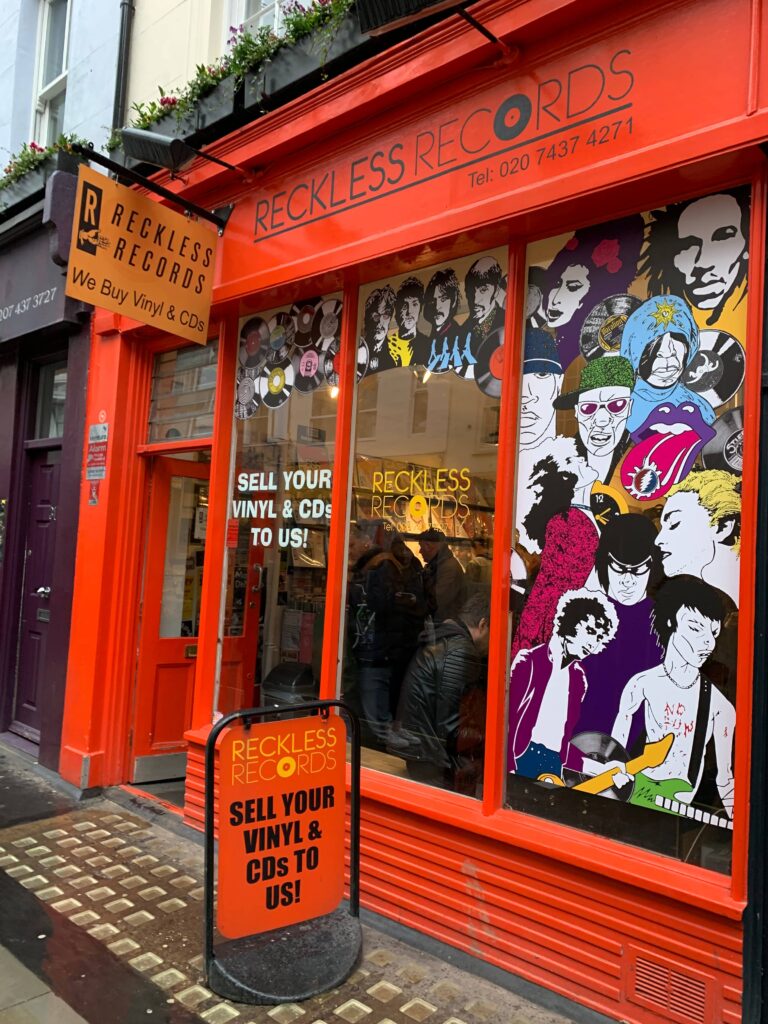 Exterior of Reckless Records, a record store in London, with a pop atmosphere.