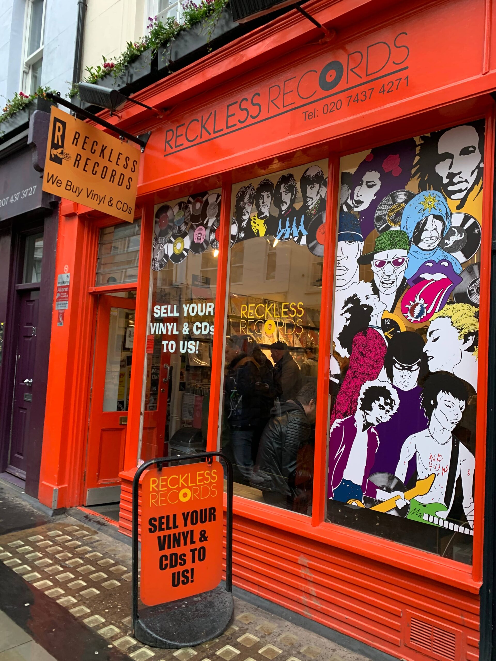 Exterior of Reckless Records, a record store in London, with a pop atmosphere.
