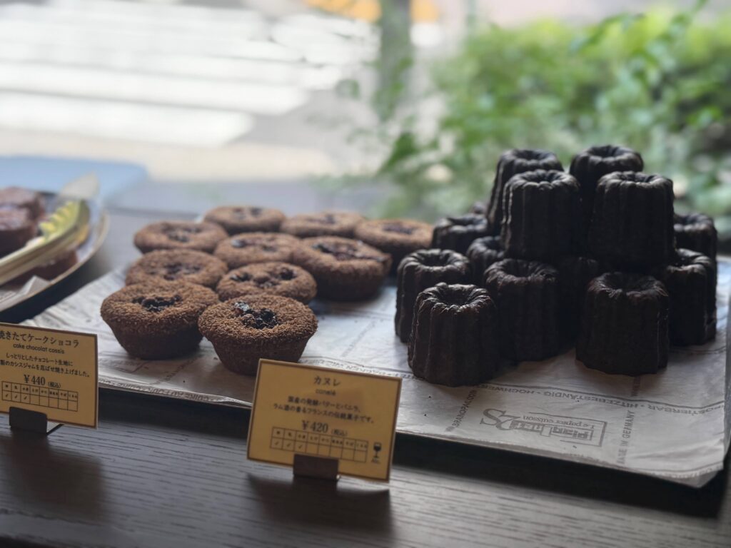 Baked goods at Patisserie ease: Canelés and Cake Chocolat