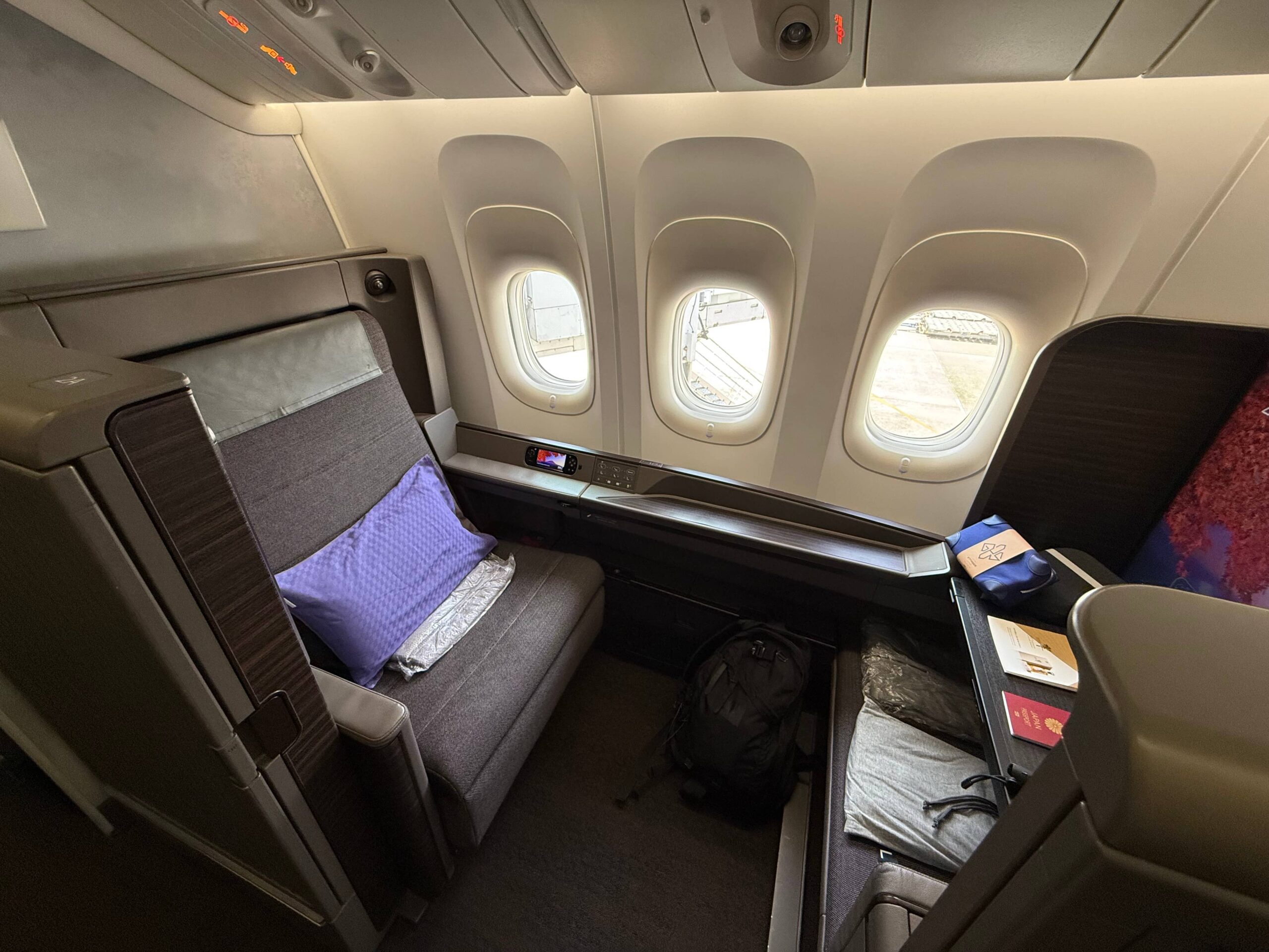 ANA First Class cabin from Haneda to London, comparing spaciousness with 