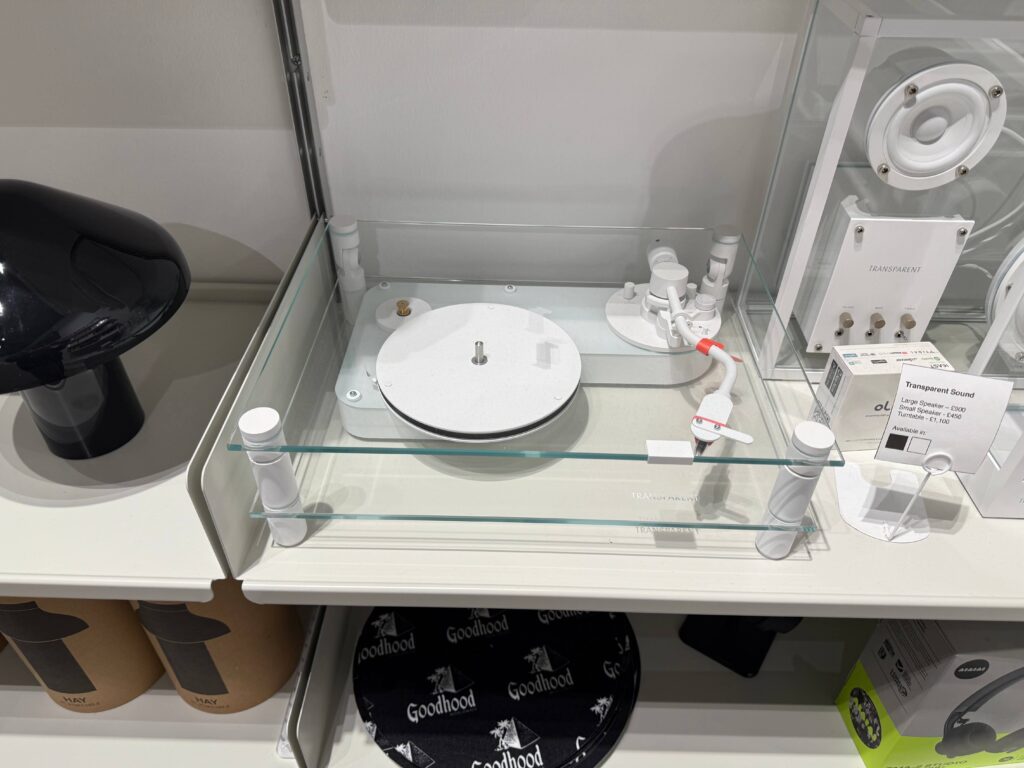 Transparent brand analog record player displayed at GOODHOOD, stylish design