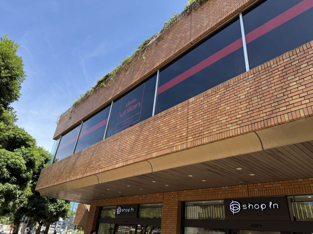 Exterior view of the Disk Union Ochanomizu store, located on the 2nd floor of a building directly connected to Ochanomizu Station.