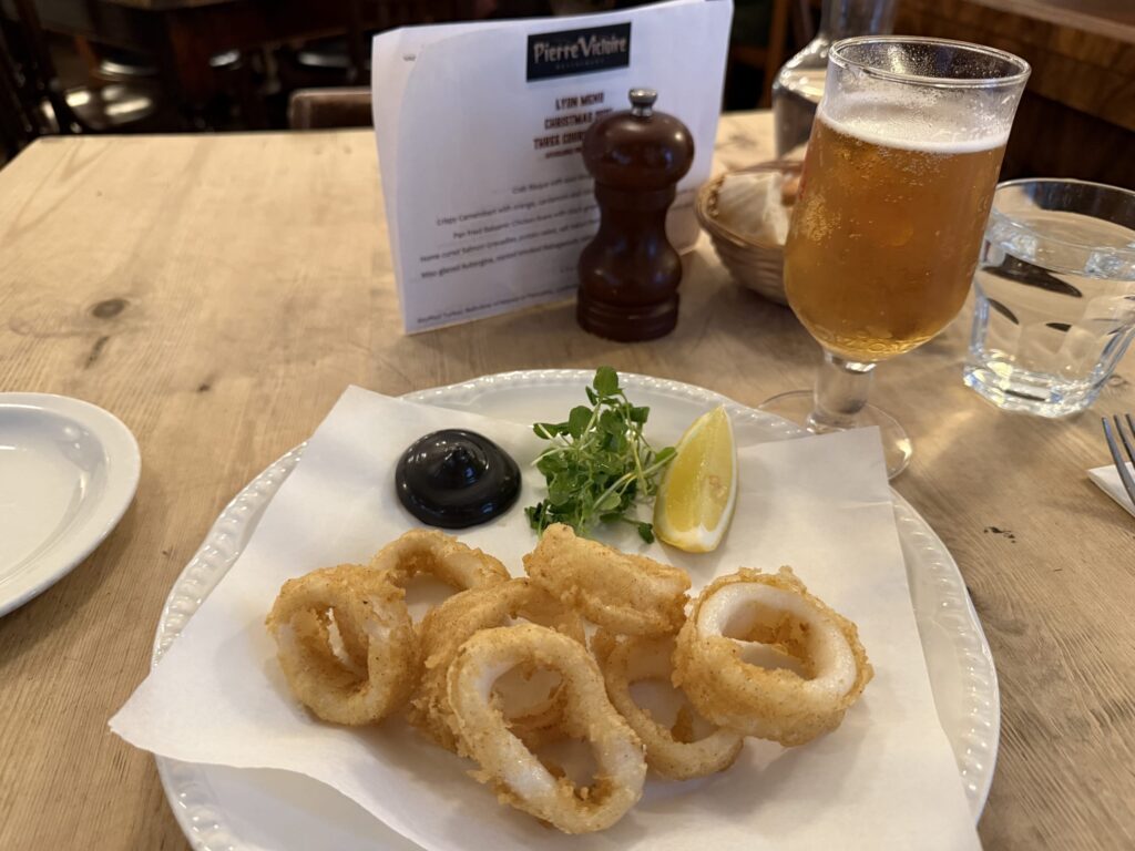 Crispy fried calamari rings, golden brown and appetizing.