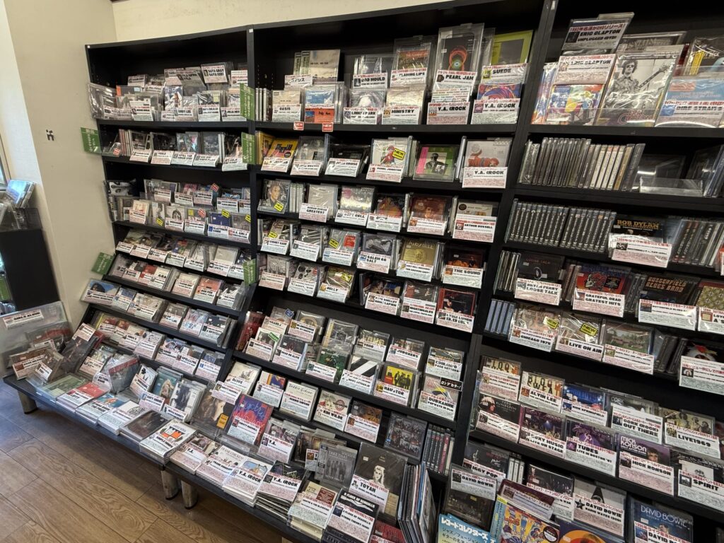 Shelves displaying new CDs organized by genre.