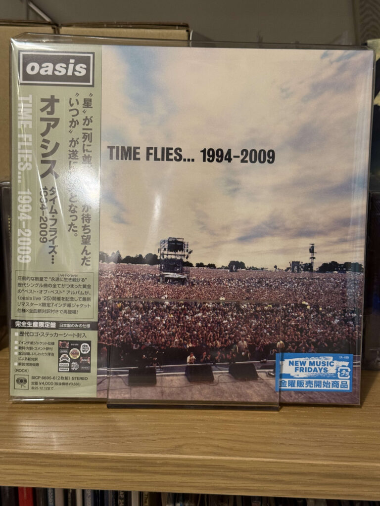 Photo of the Time Flies remastered Japan complete production limited edition CD jacket and bonus sticker.