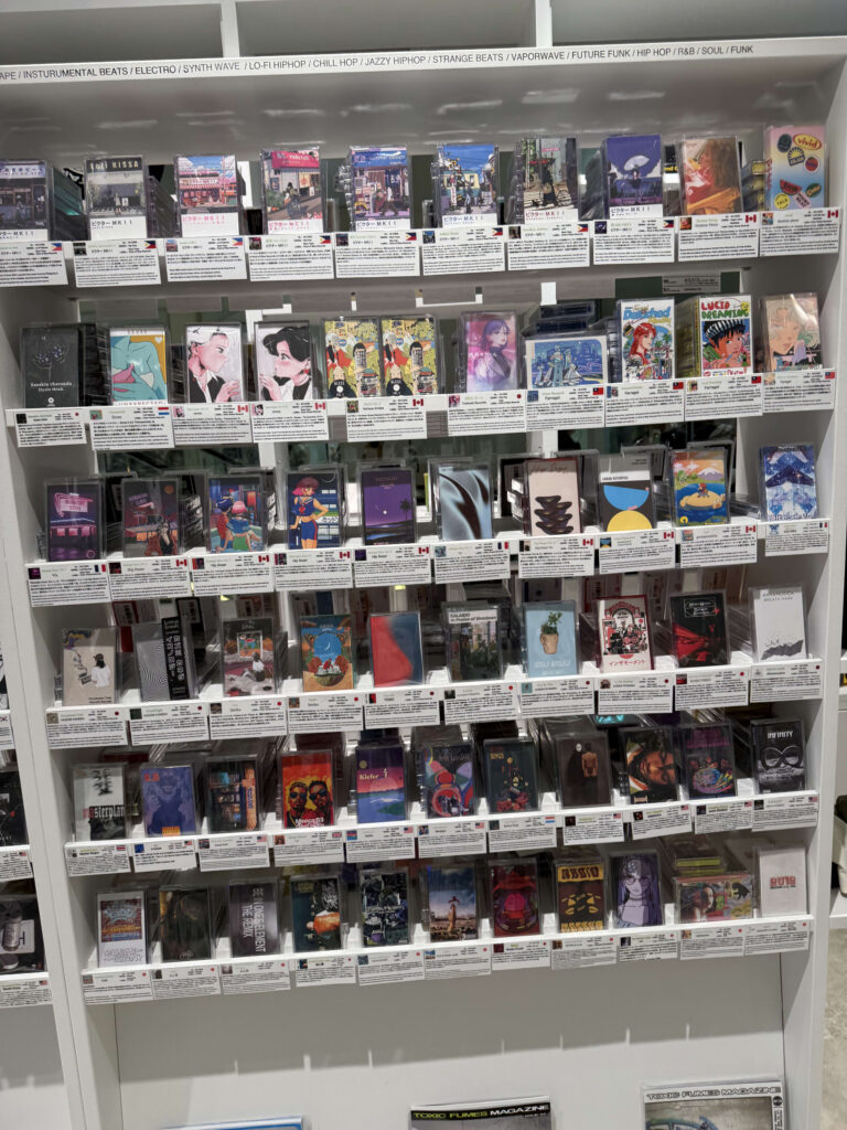 A collection of colorful Lo-Fi Hip-Hop and Electro genre cassette tapes packed tightly on a shelf.