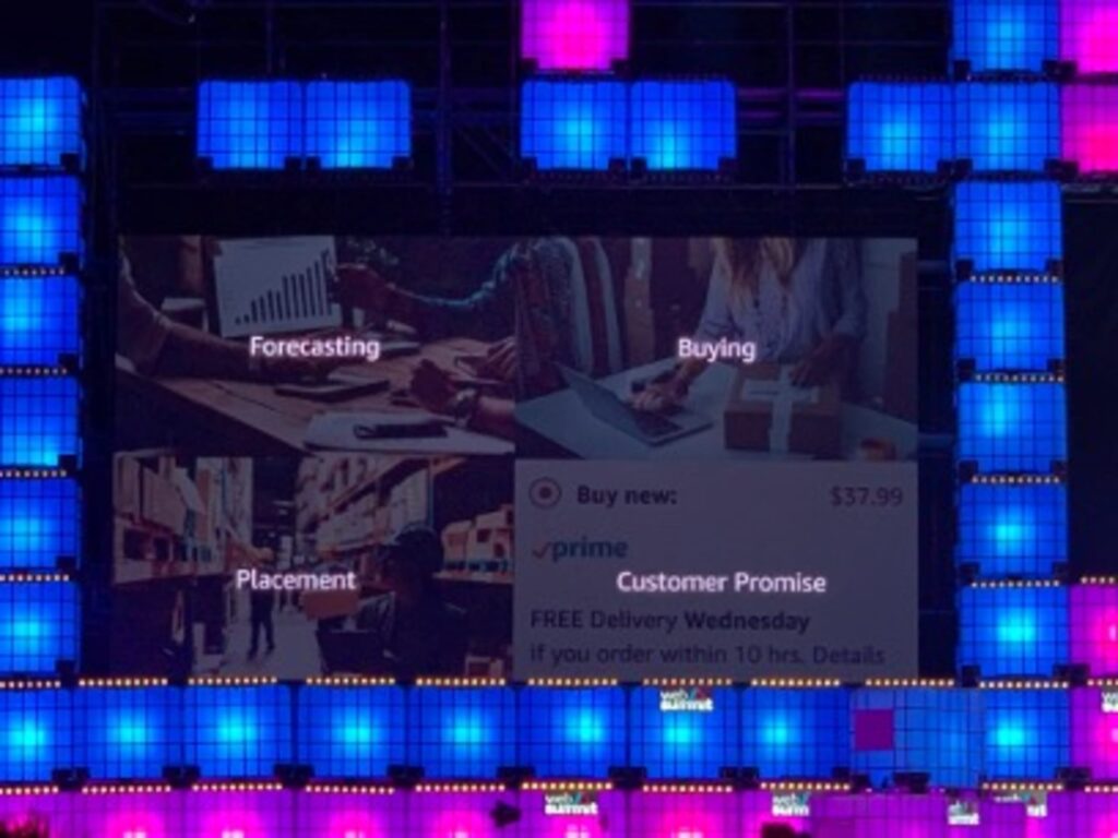 A presentation slide titled 'TRAINING AMAZON's AI'. It lists four points for training AI, along with icons: 'Massive Scale', 'Breadth of Choices', 'Human Feedback', and 'Experimentation Culture'.