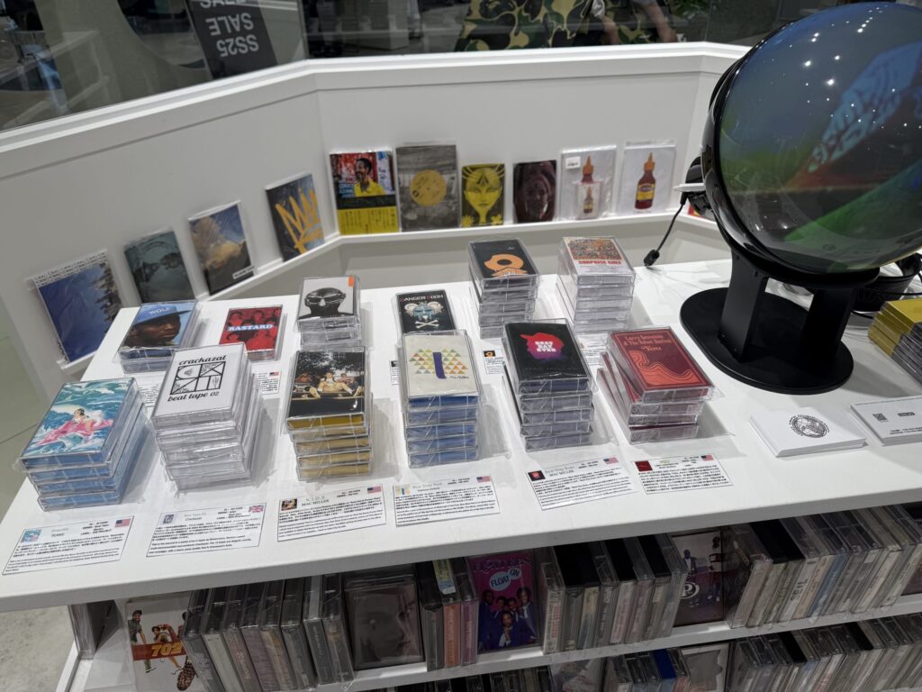 Several colorful cassette tapes lined up on a wooden table.