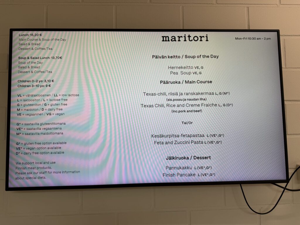 Digital display showing maritori's lunch menu with daily soup, main courses, dessert, and allergy information.