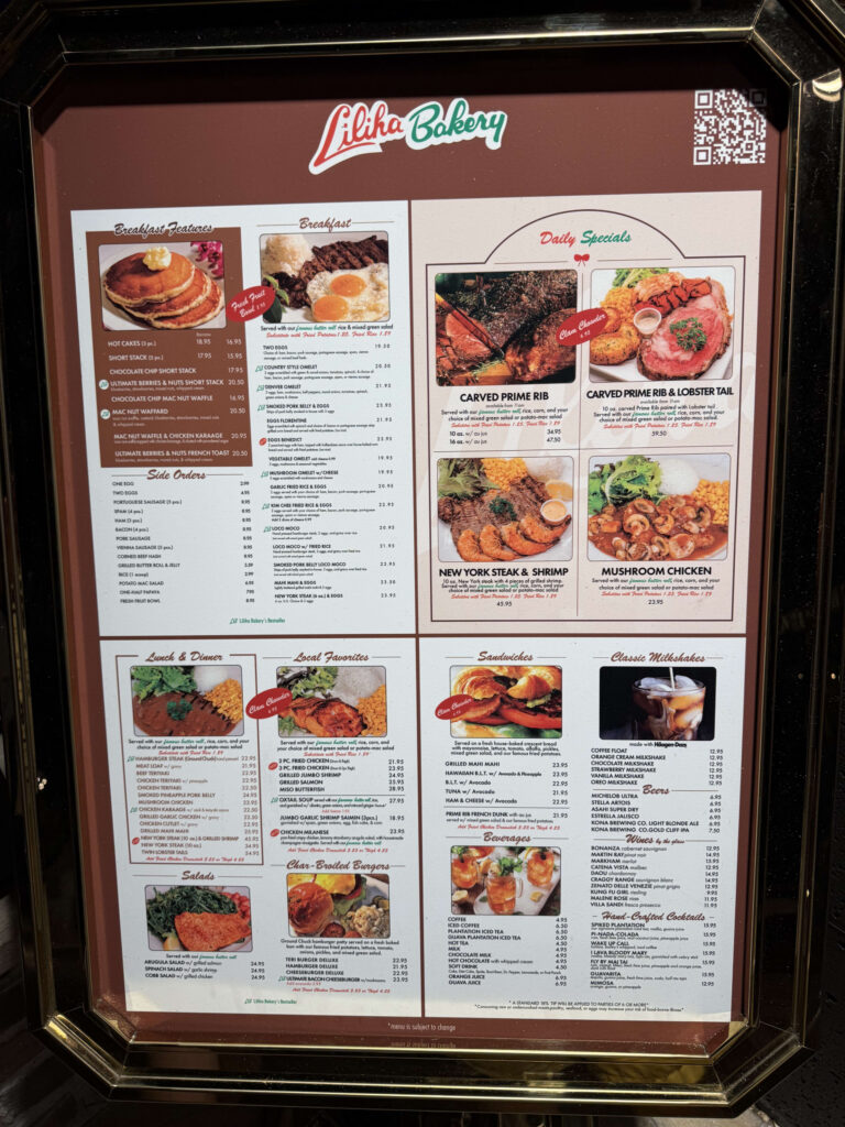 The framed menu of Liliha Bakery, showcasing various dishes with photos for breakfast, lunch, dinner, and daily specials.
