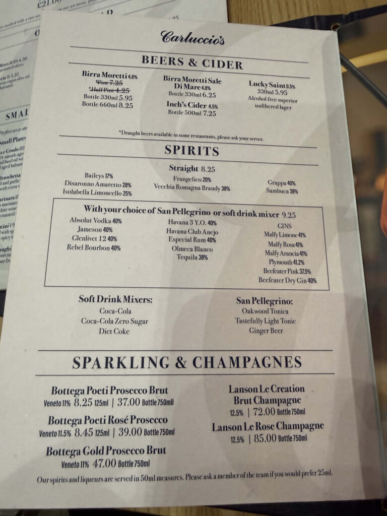 Carluccio's drinks menu showing sections for Beers & Cider, Spirits, and Sparkling & Champagnes.