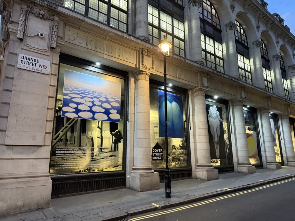Exterior of Dover Street Market London featuring Georgia O'Keeffe window displays on Orange Street