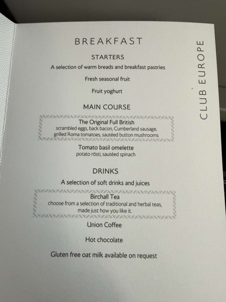 British Airways 'Club Europe' breakfast menu card listing options for starters, main courses including The Original Full British, and drinks.