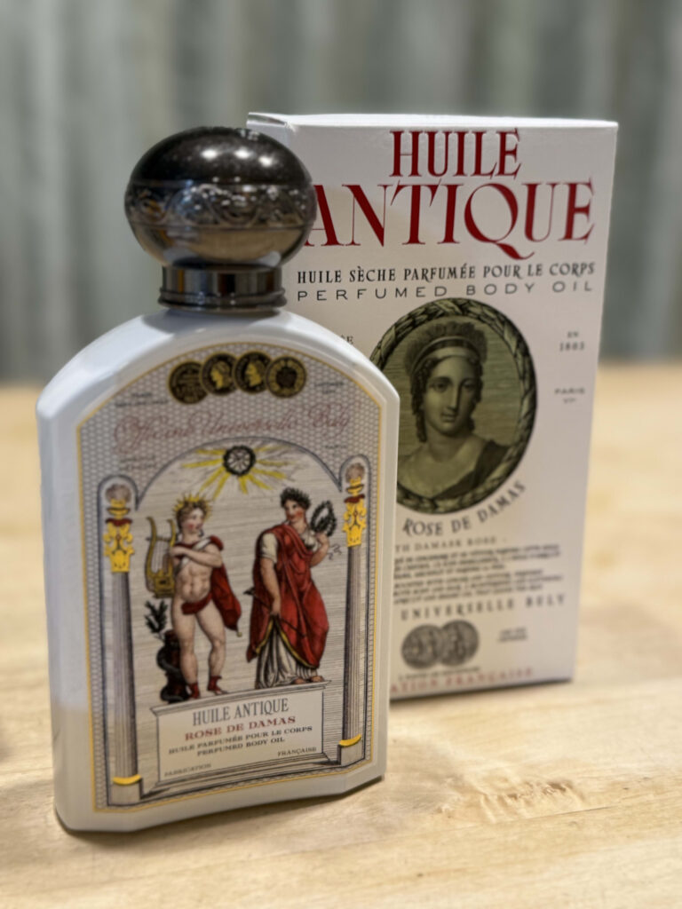Bottle and packaging of Officine Universelle Buly Huile Antique body oil in Rose de Damas scent