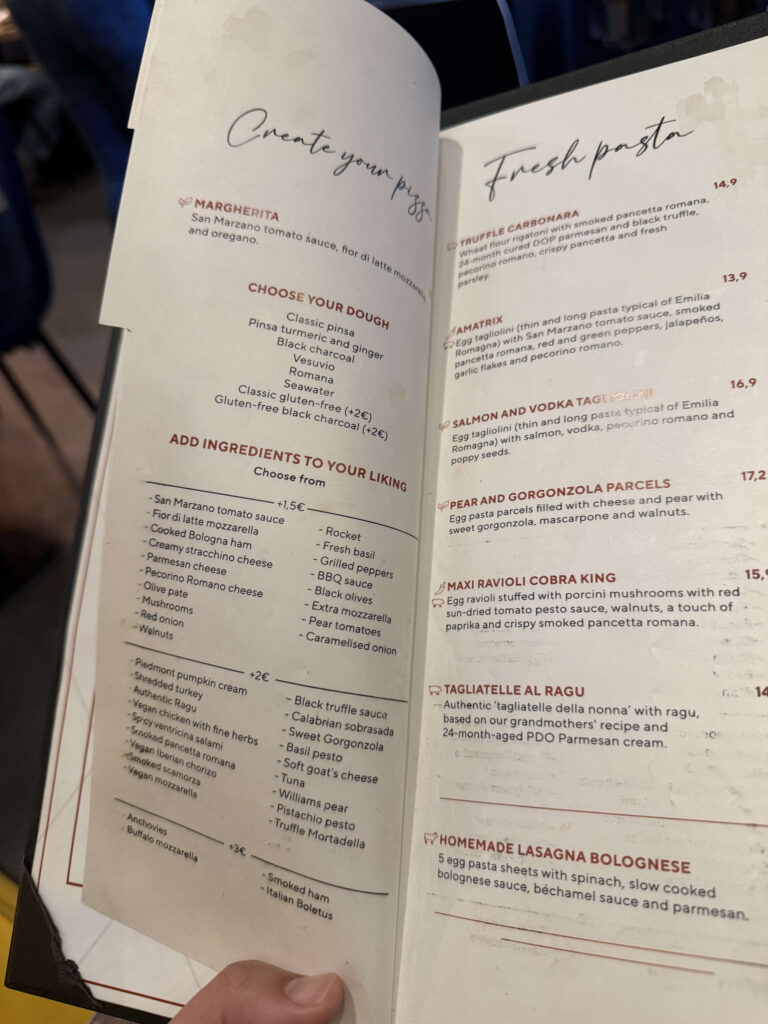 TOTALE restaurant menu displaying 'Create your pizza' customization options and a 'Fresh pasta' list.