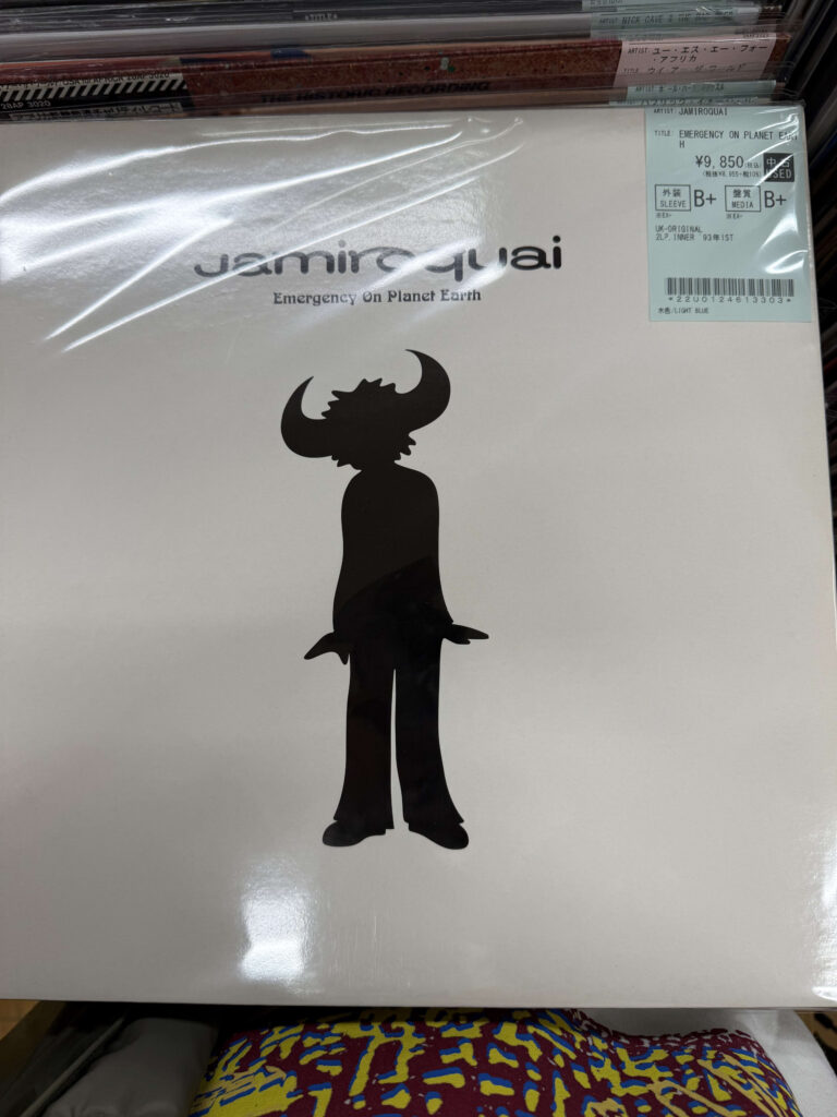 Vinyl record cover of Jamiroquai's 1993 debut album 'Emergency On Planet Earth', featuring a black silhouette of the Buffalo Man on a white background with a price sticker in the top right corner.