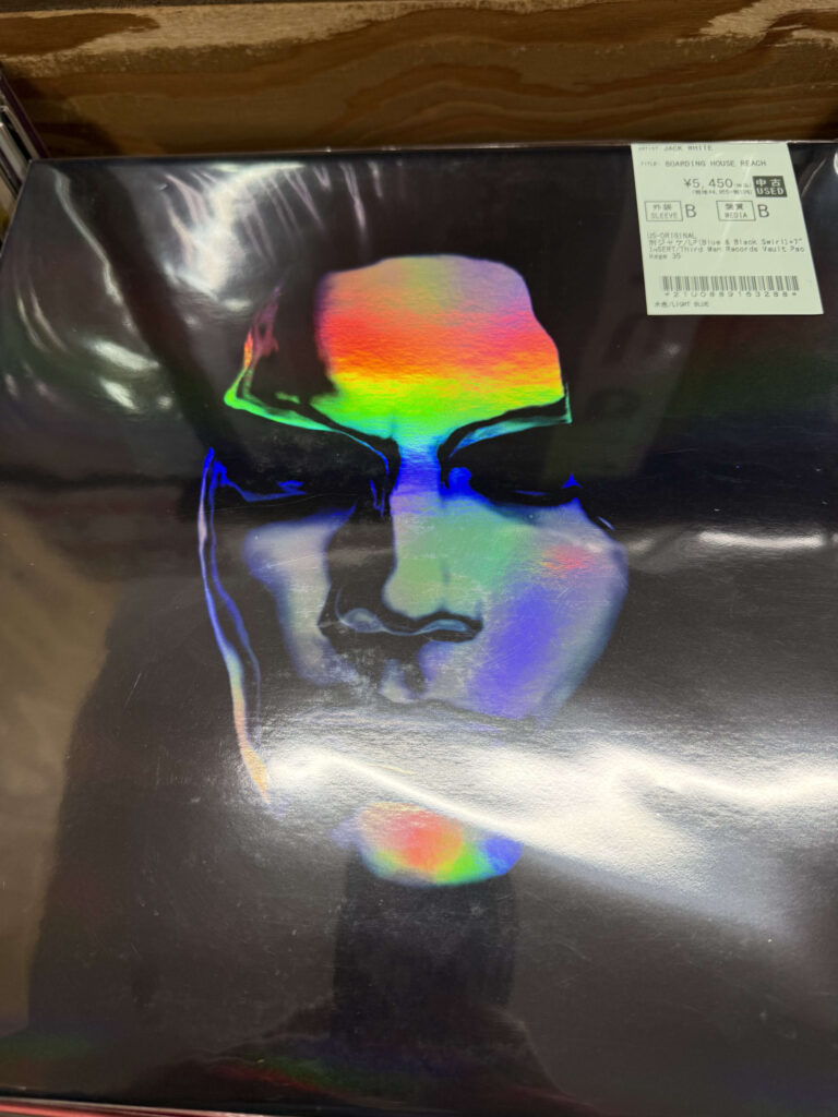 Vinyl record cover for Jack White's album Boarding House Reach featuring a holographic face design on a black background.