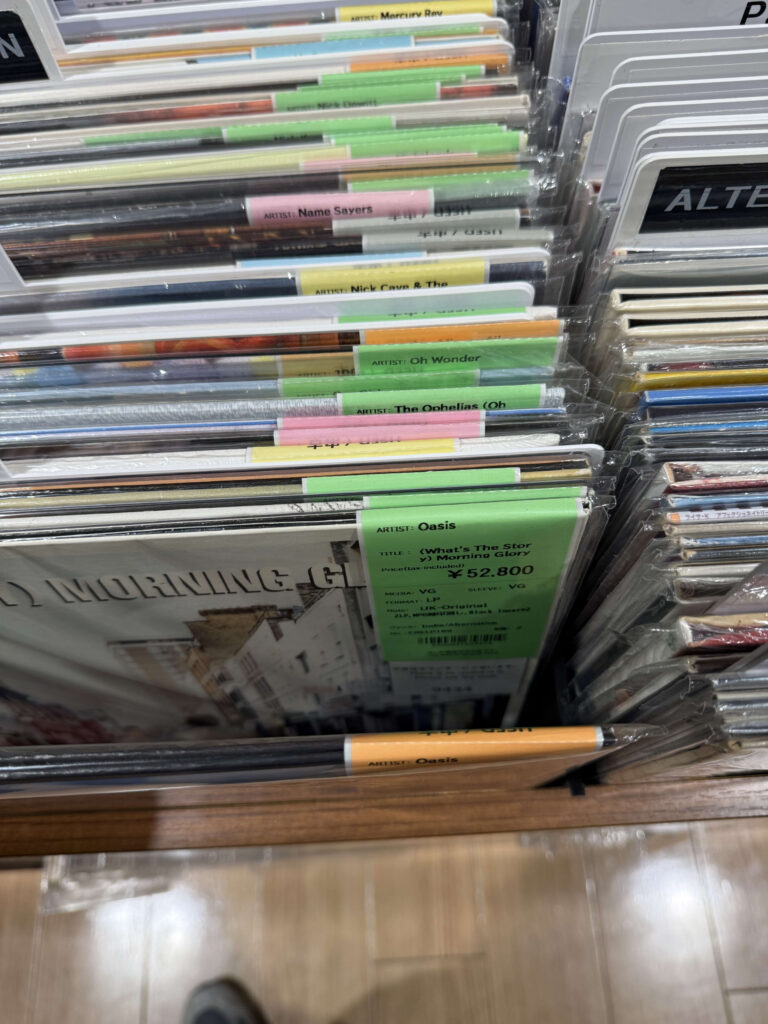 UK Original pressing of Oasis's '(What's The Story) Morning Glory?' vinyl record with a price tag of 52,800 yen in a record store bin