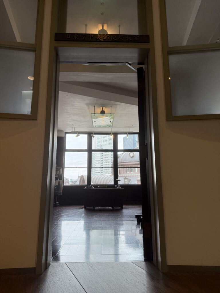 View from the entrance looking into the Former Tokyo Central Post Office Director's Room with a desk and large window