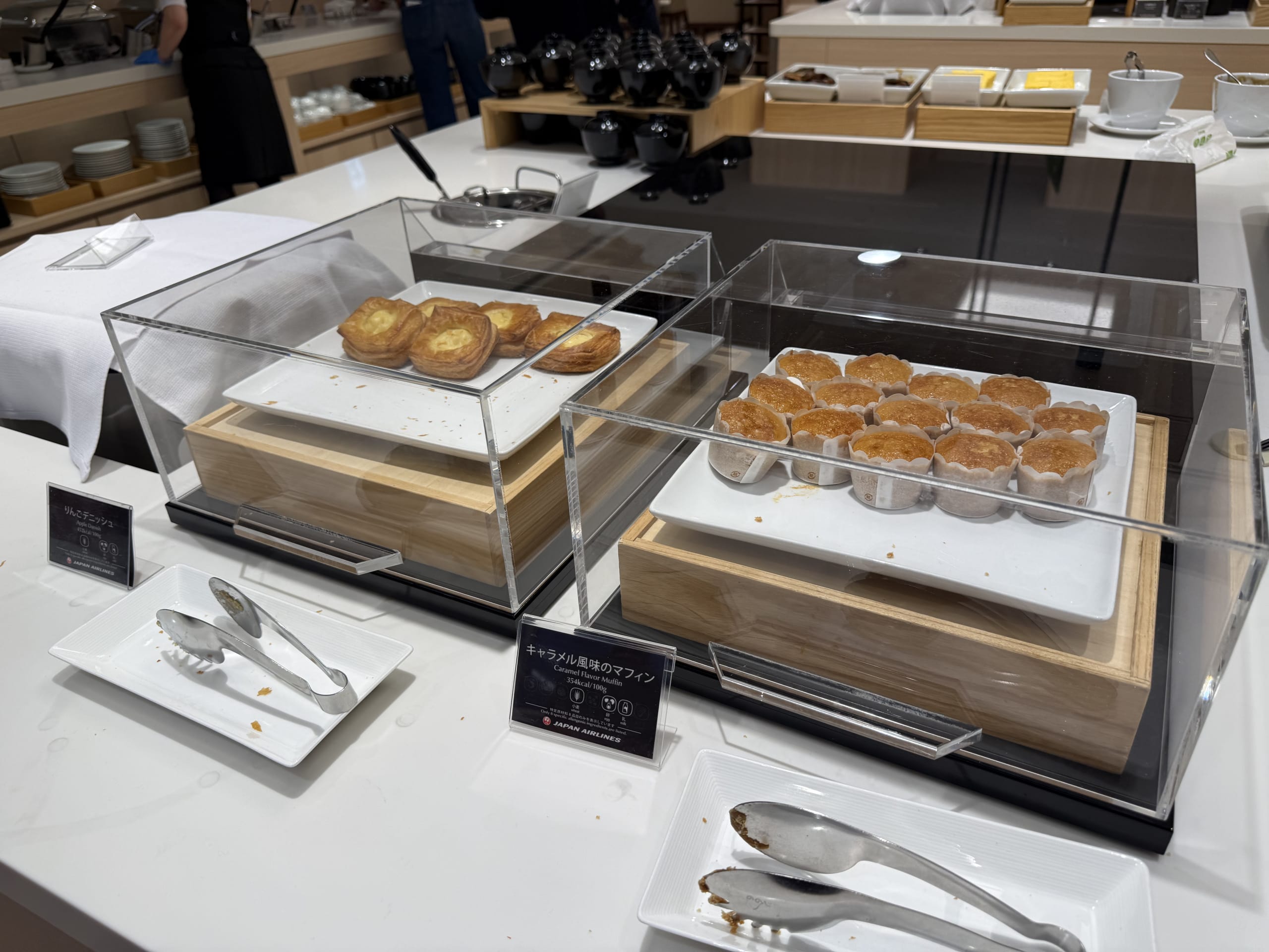 Pastries and muffins at an airport lounge.