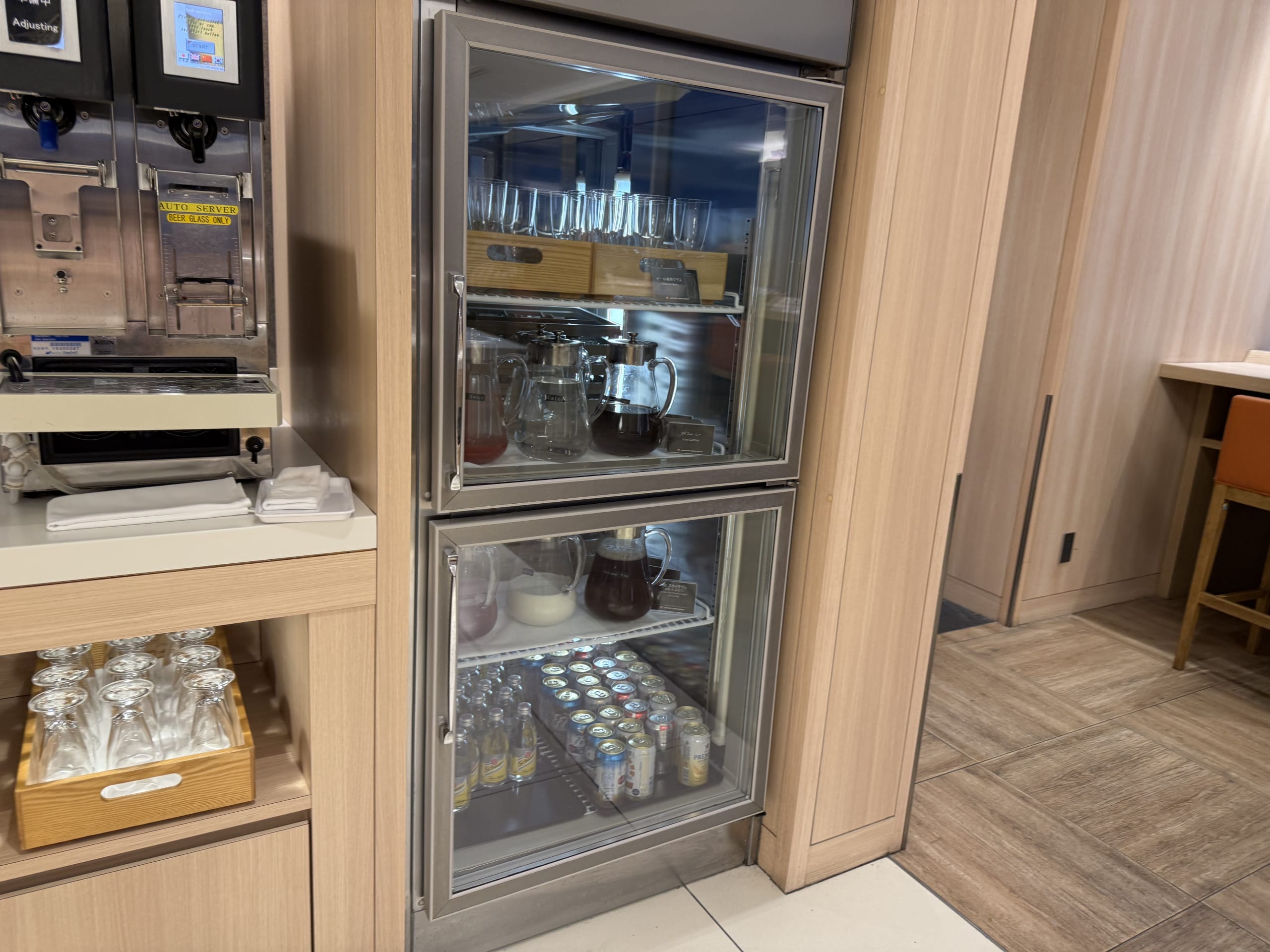 Lounge drink station with fridge and beer server.