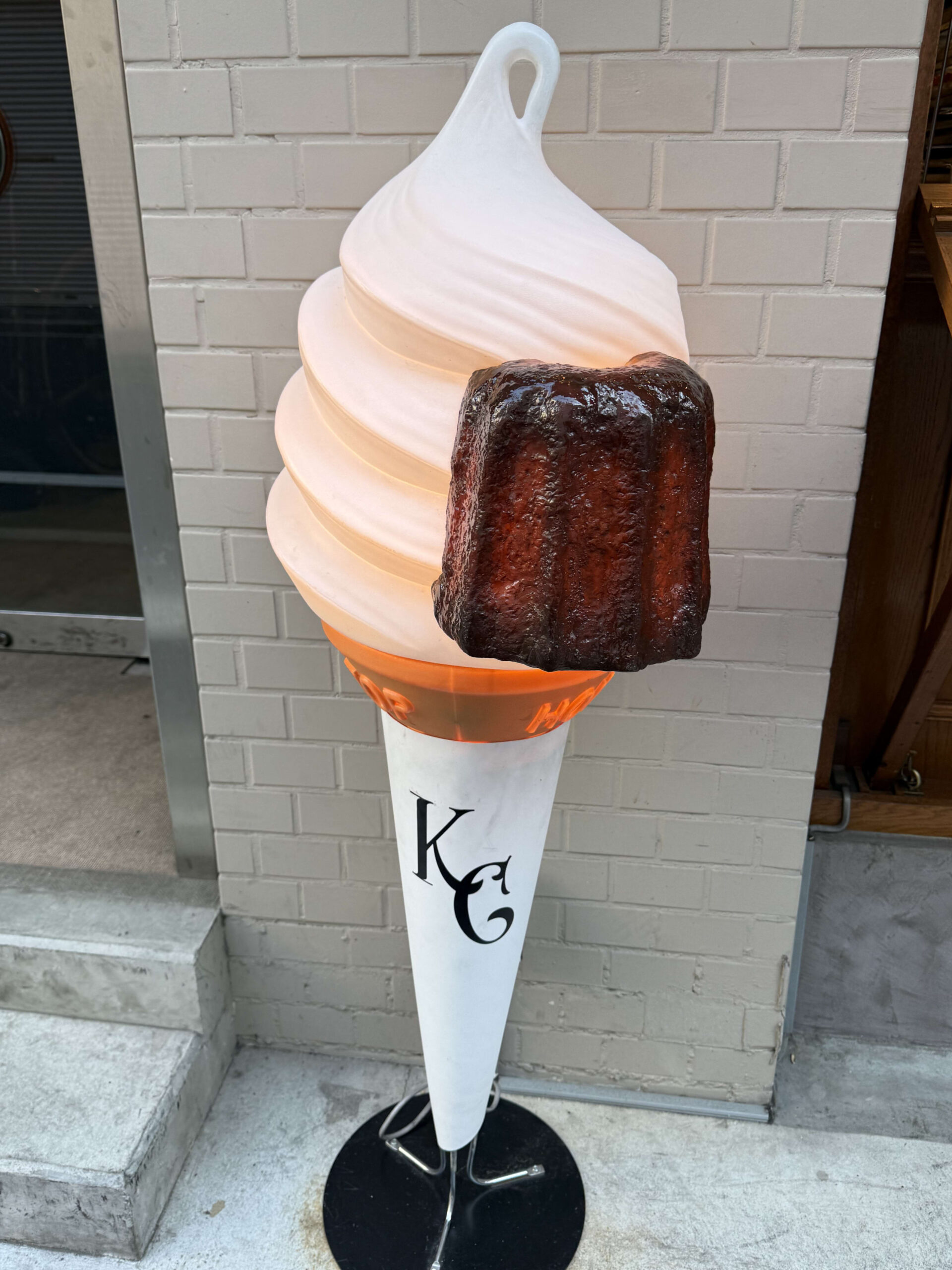 Soft serve sign with an attached cannele.