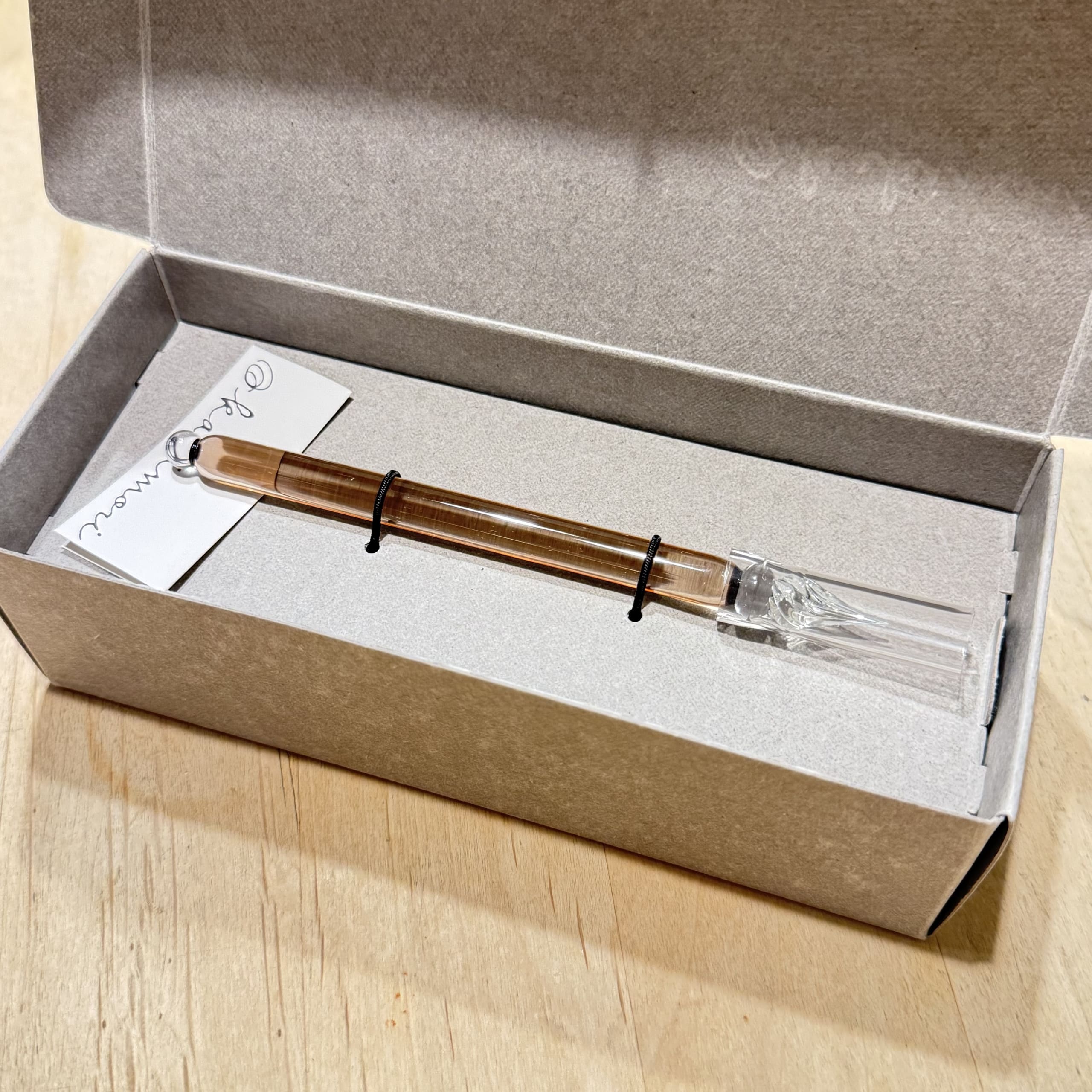 Kakimori amber glass pen in a box.