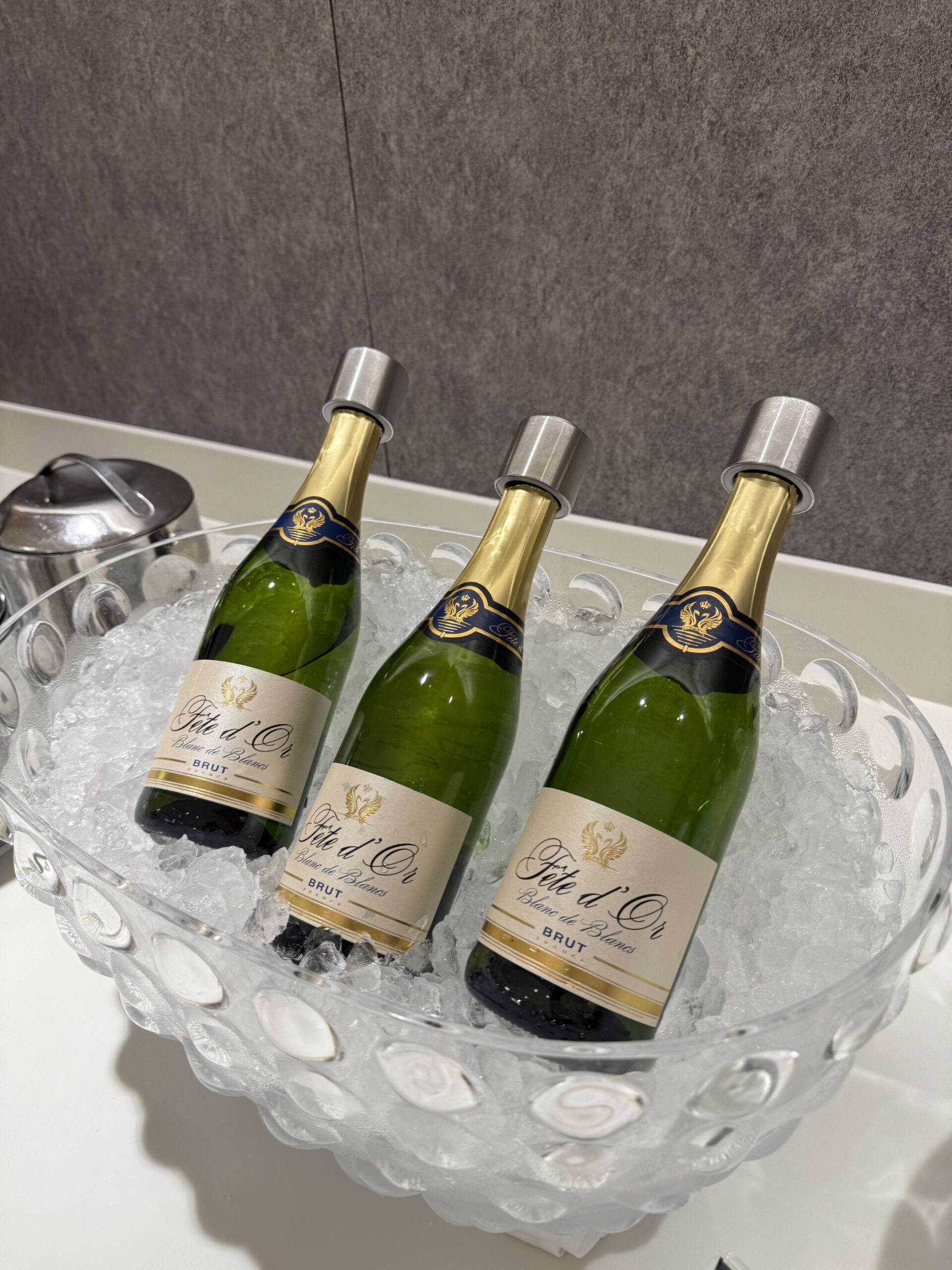 3 chilled sparkling wines in an ice bowl.