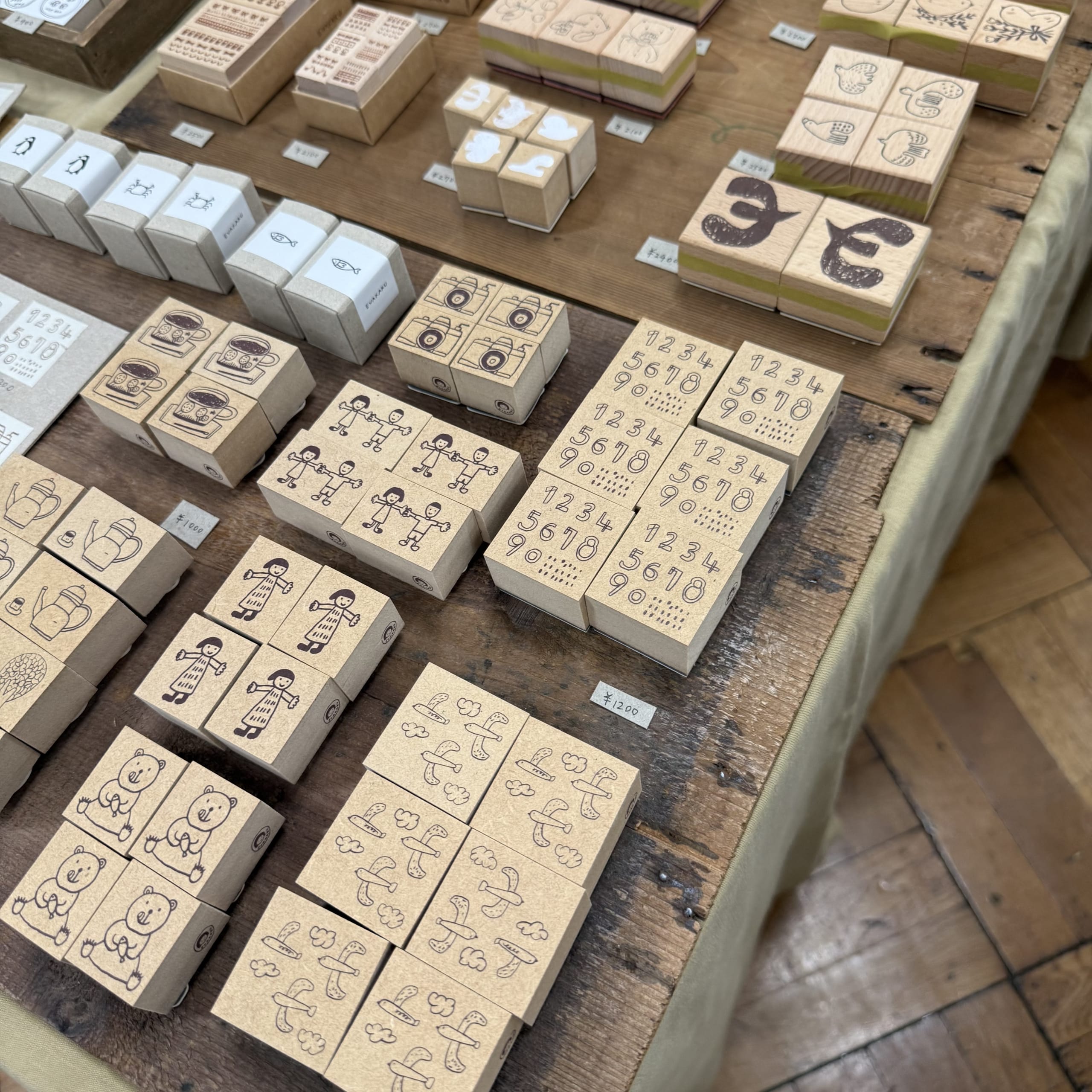Illustrated wooden stamps arranged on a table.