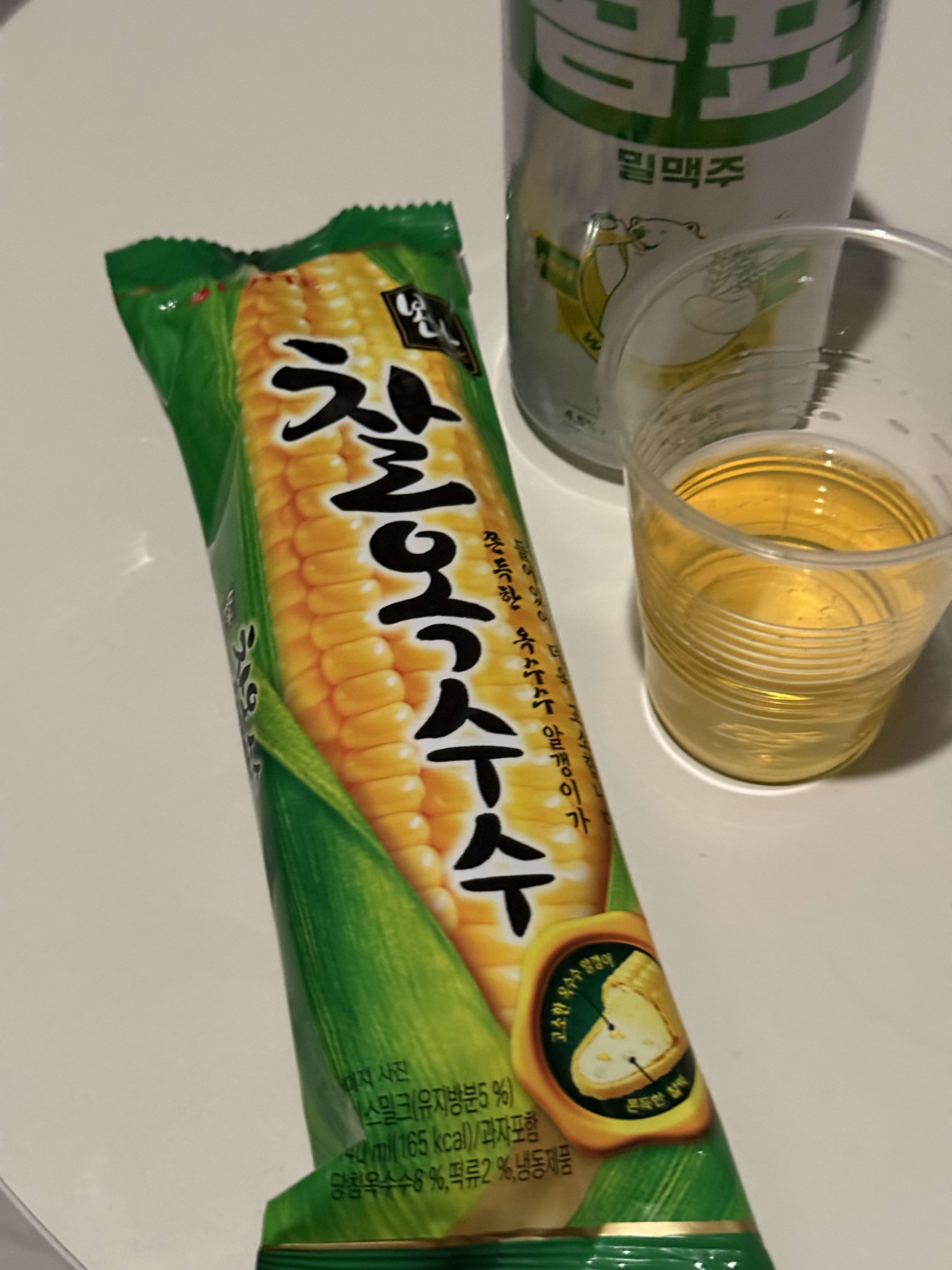 Korean beer and colorful snacks lining the shelves at E-Mart 24