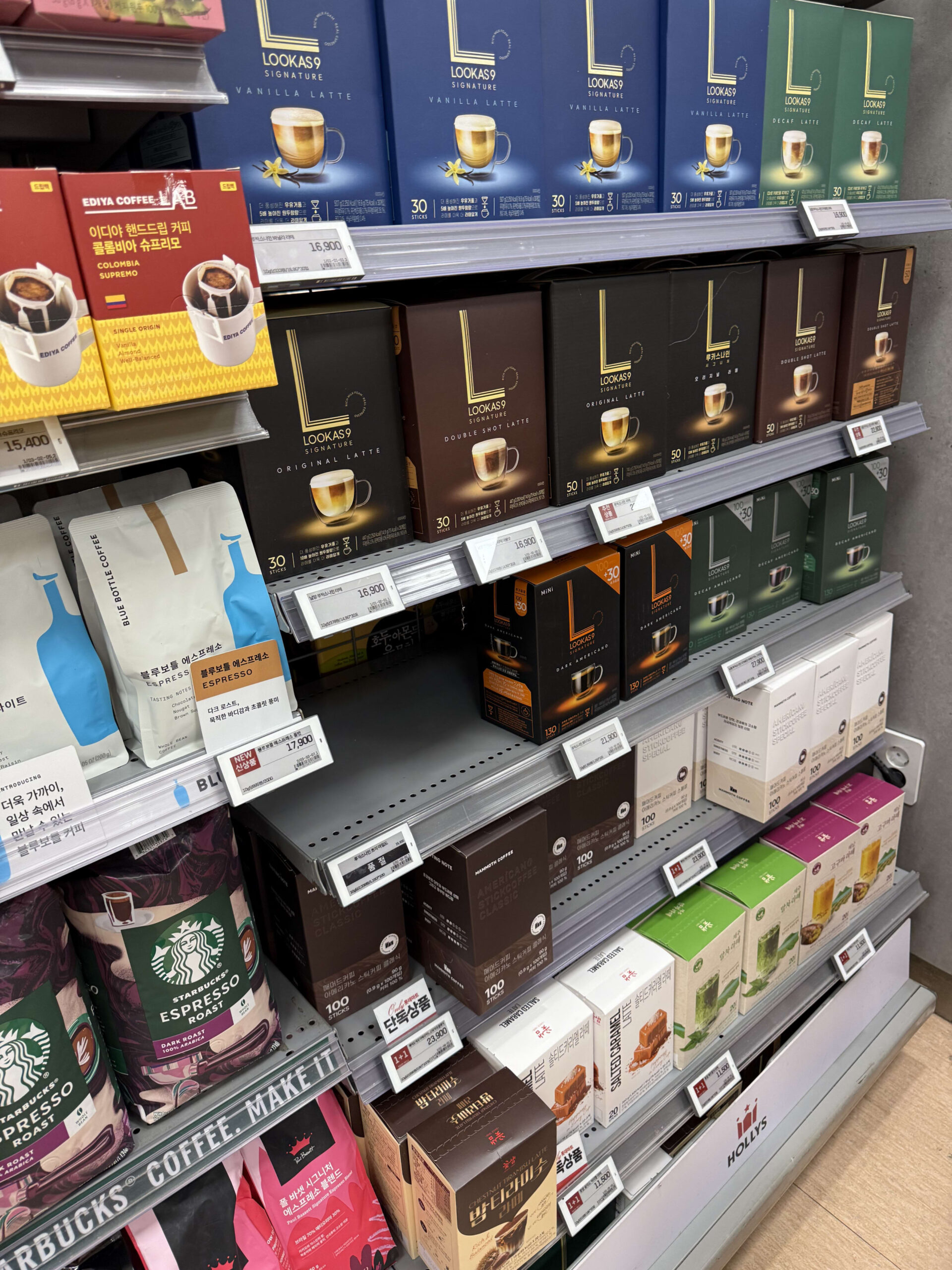 Shelves packed with various Korean stick coffees.