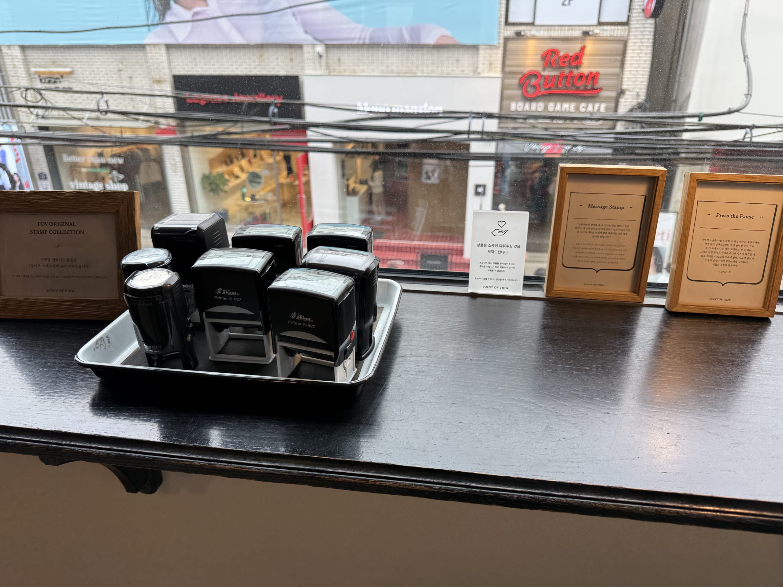 Self-inking stamps on a black window counter.