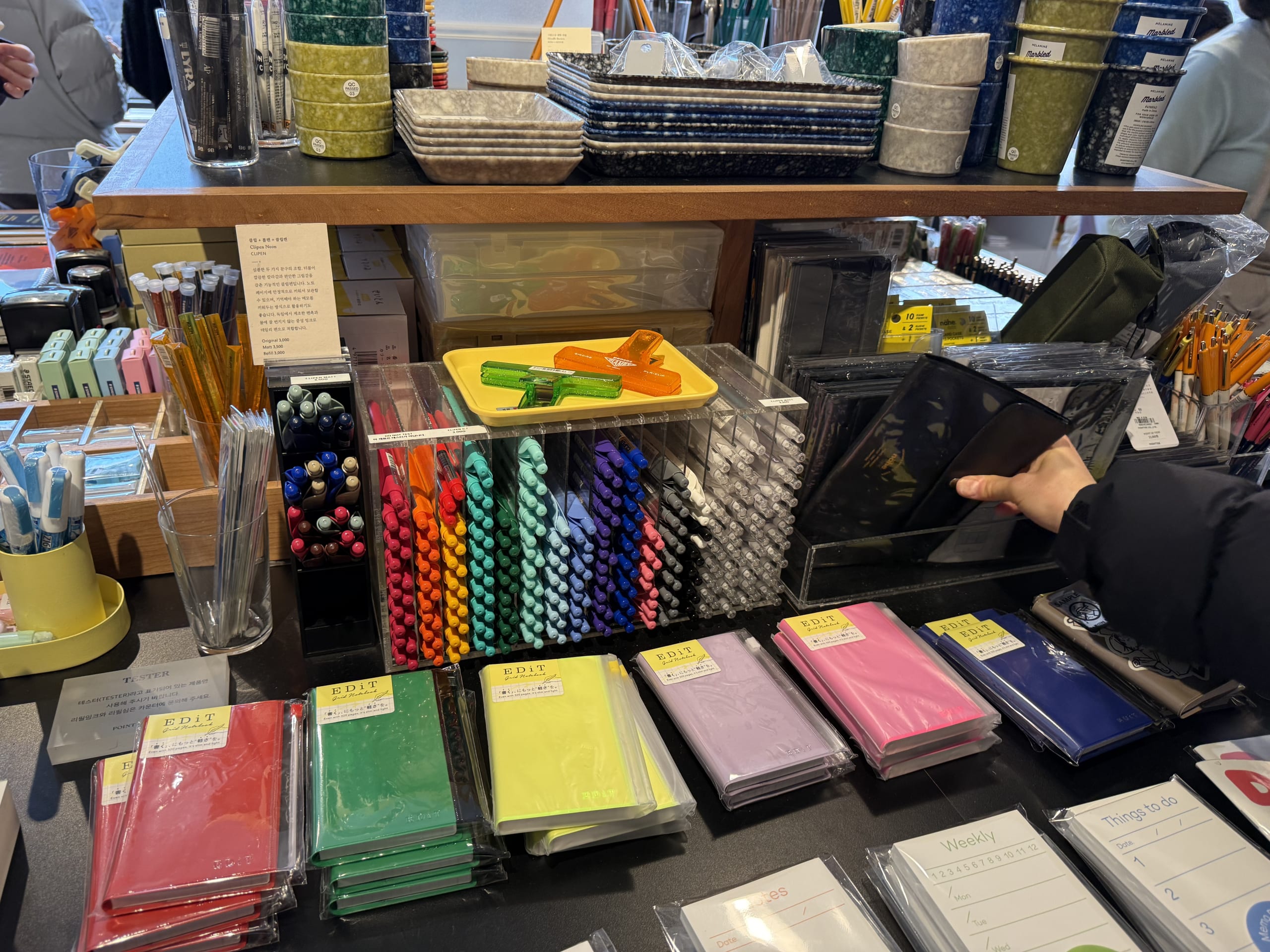 Colorful stationery arranged on a store shelf.