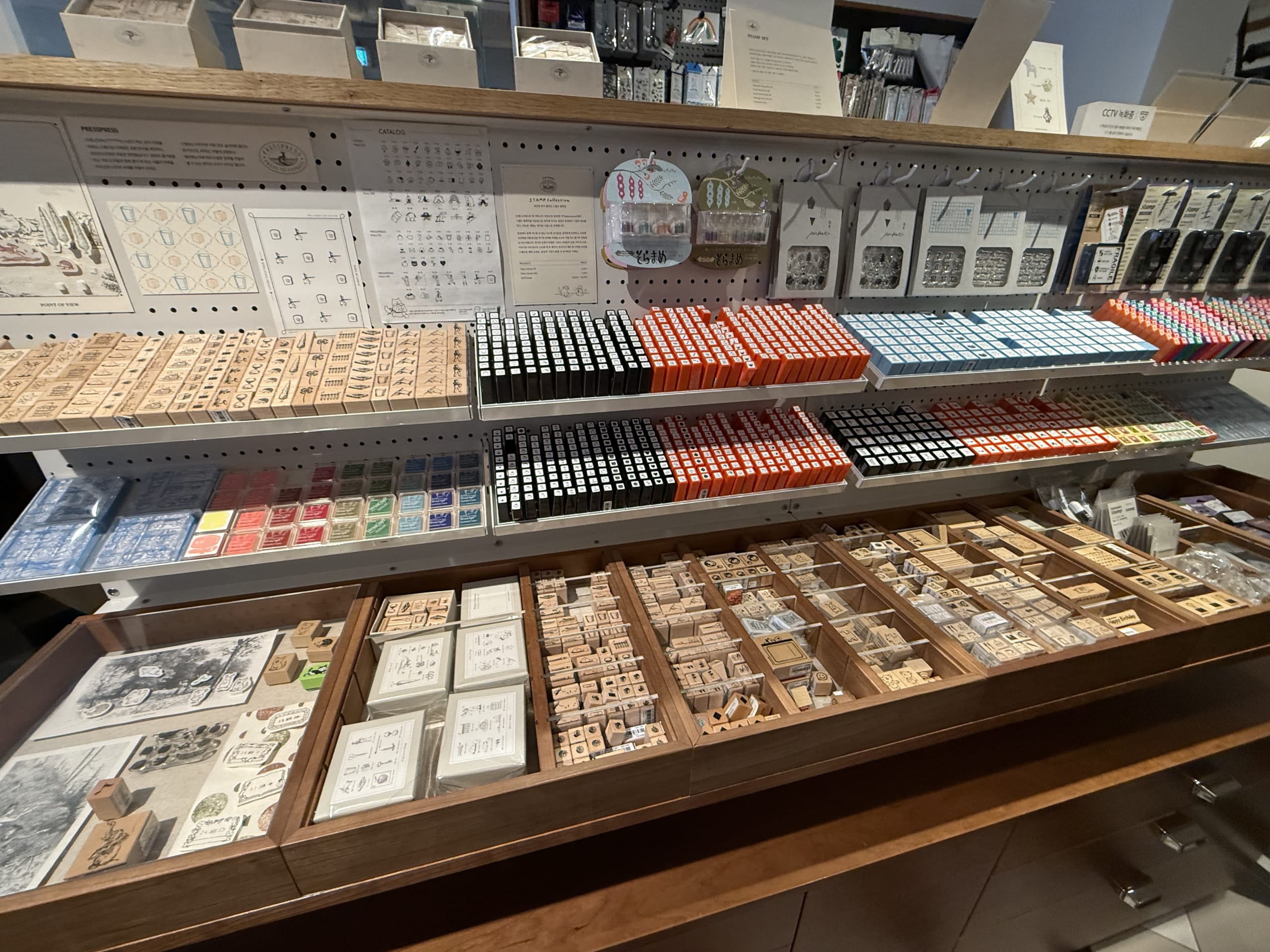 Display of wooden stamps and colorful ink pads.