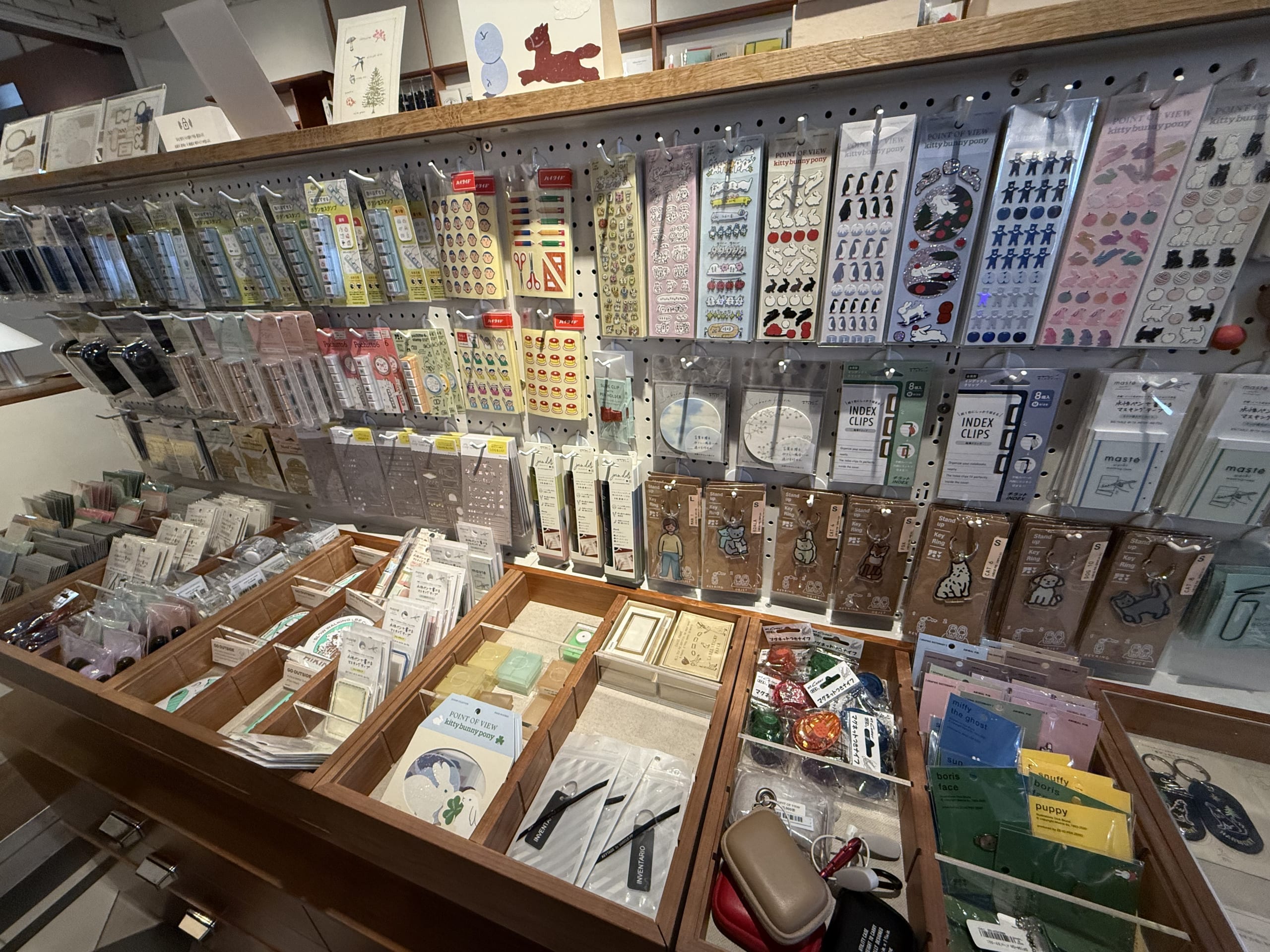 Stationery packed on wooden shelves at Point of View.