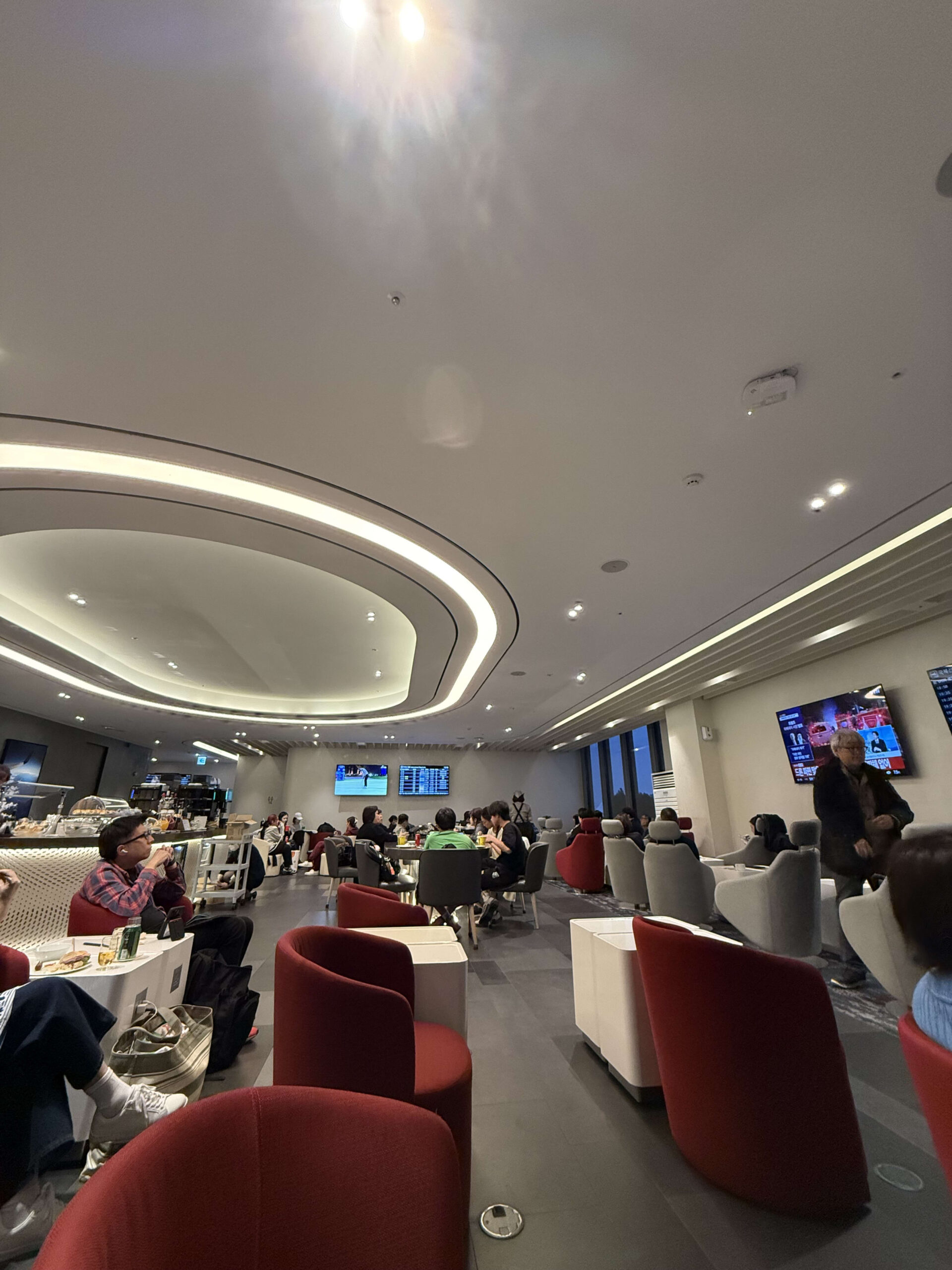 Travelers relaxing in Gimpo Airport KAL Lounge.