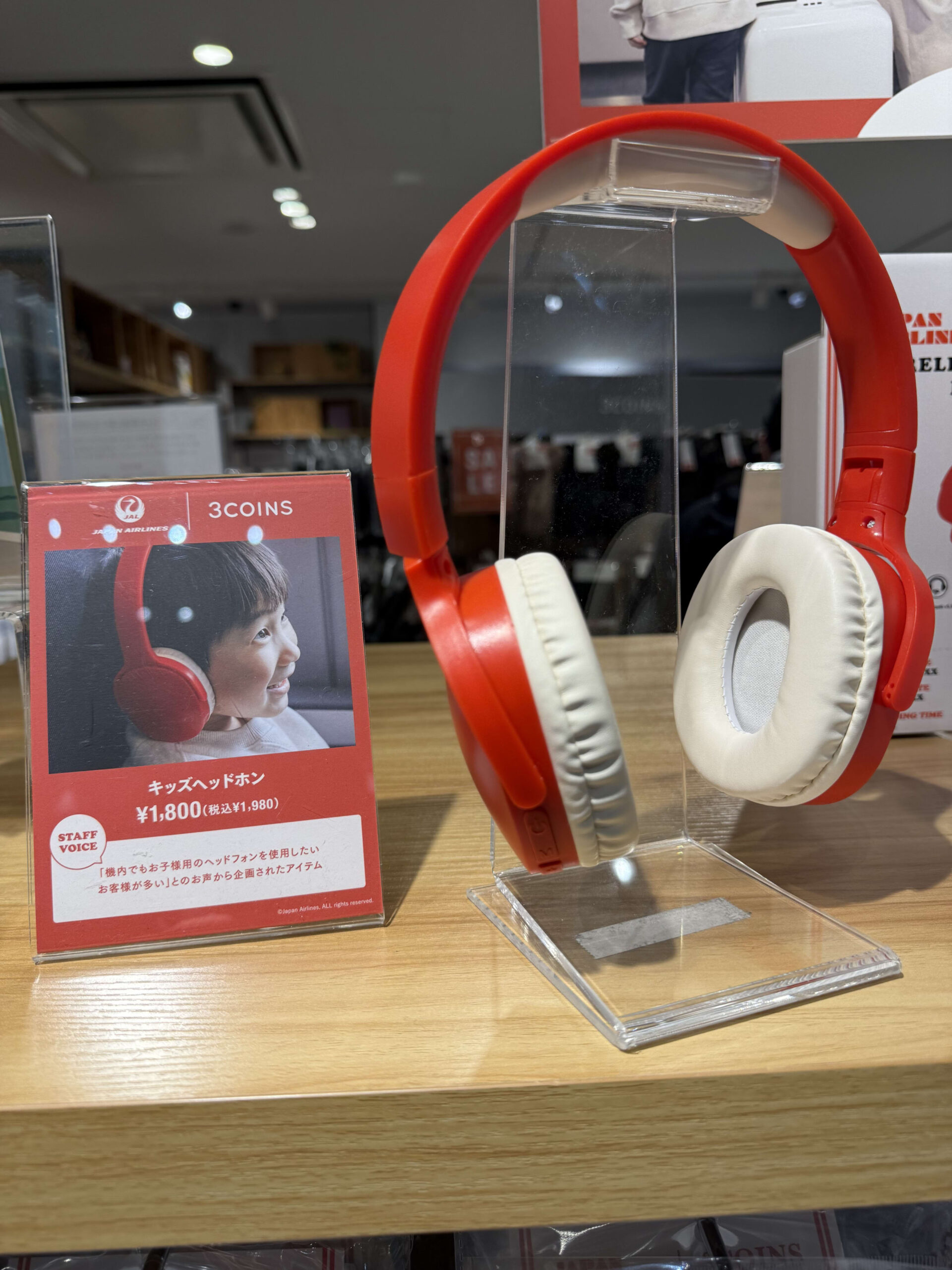 JAL collab red kids' headphones on display.
