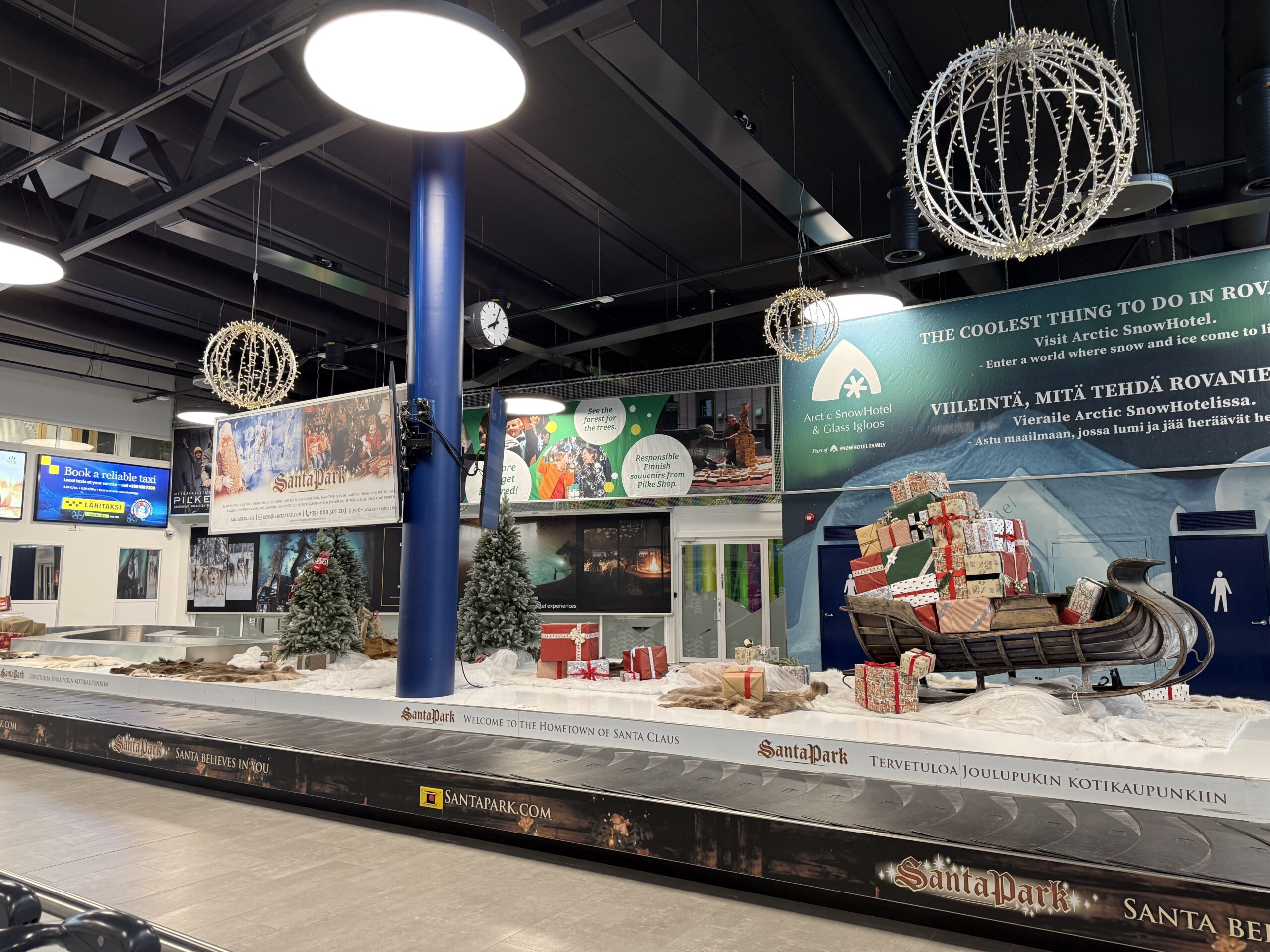 Baggage claim decorated for Christmas at Rovaniemi Airport