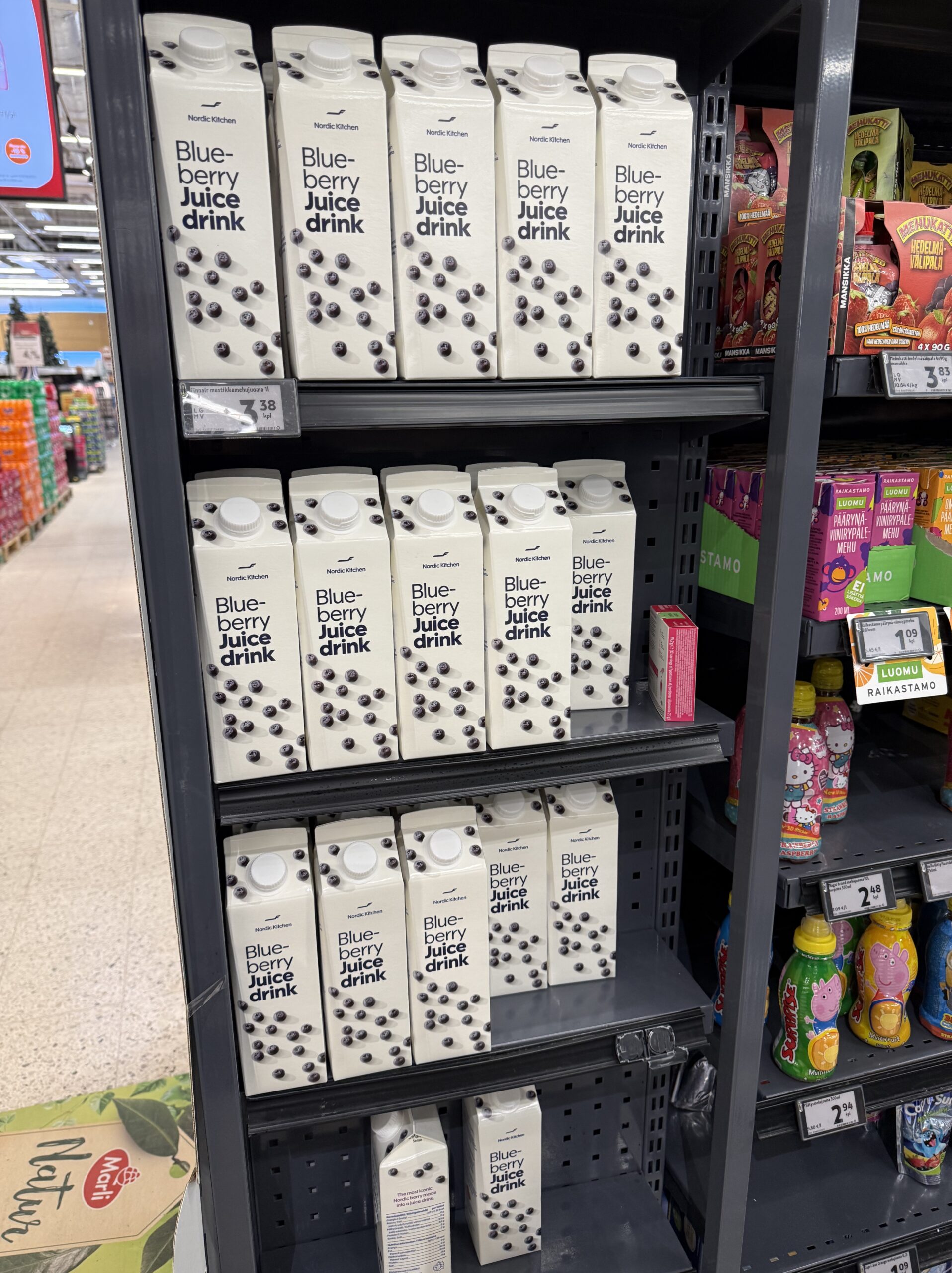Blueberry juice boxes stacked deeply on shelves
