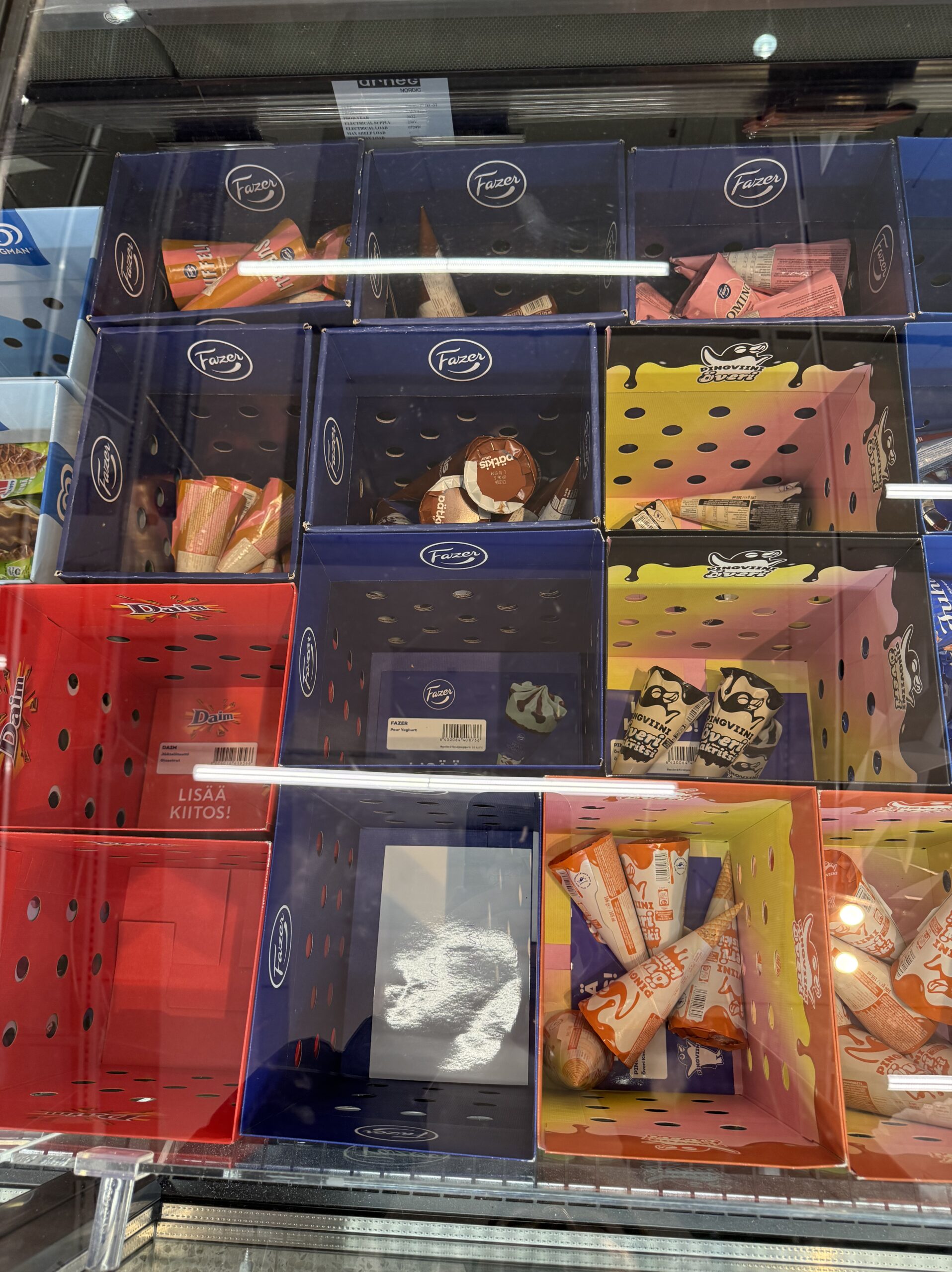 Vibrant ice cream packages in a freezer