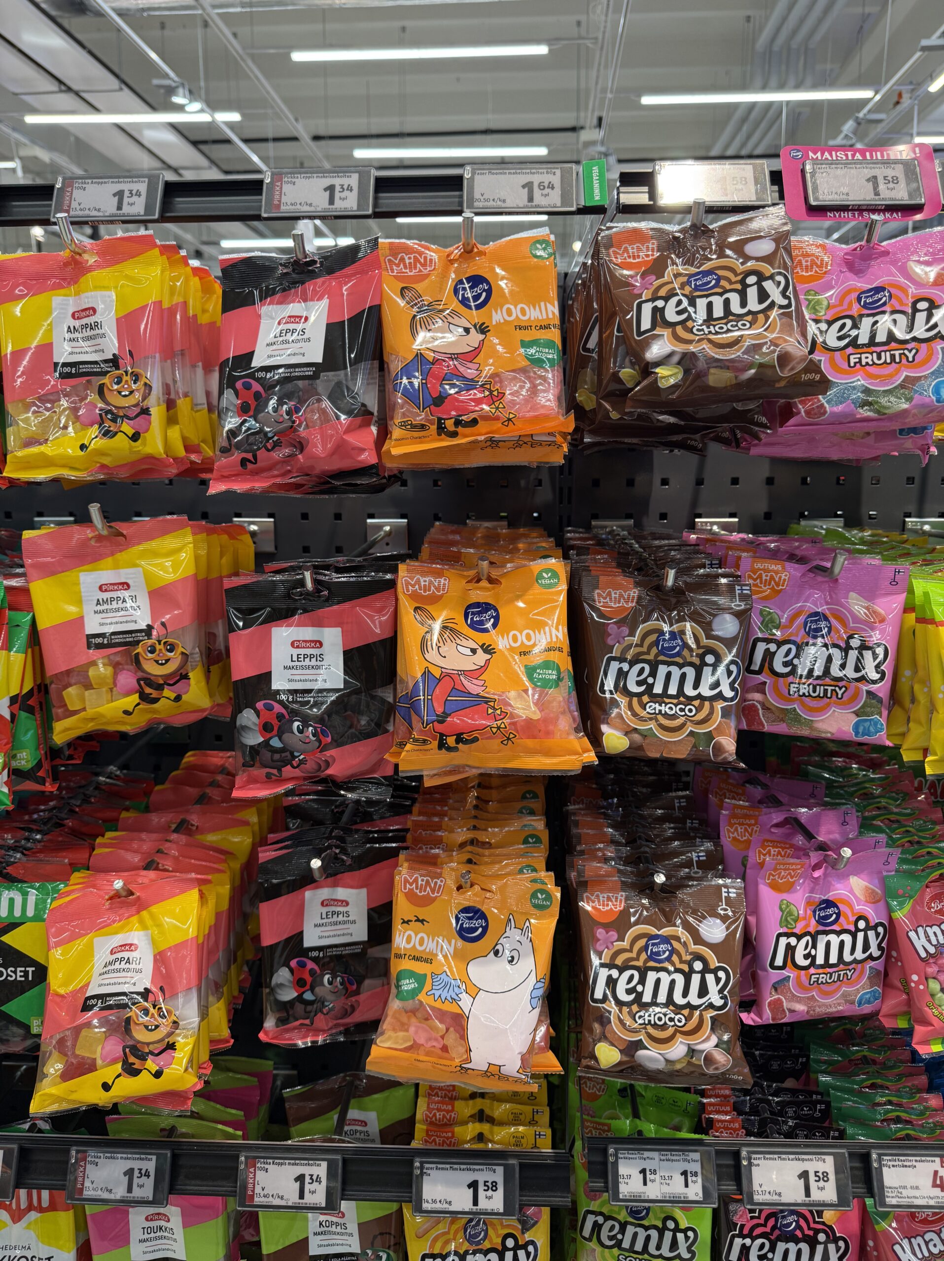 Colorful gummies and candies on a supermarket shelf