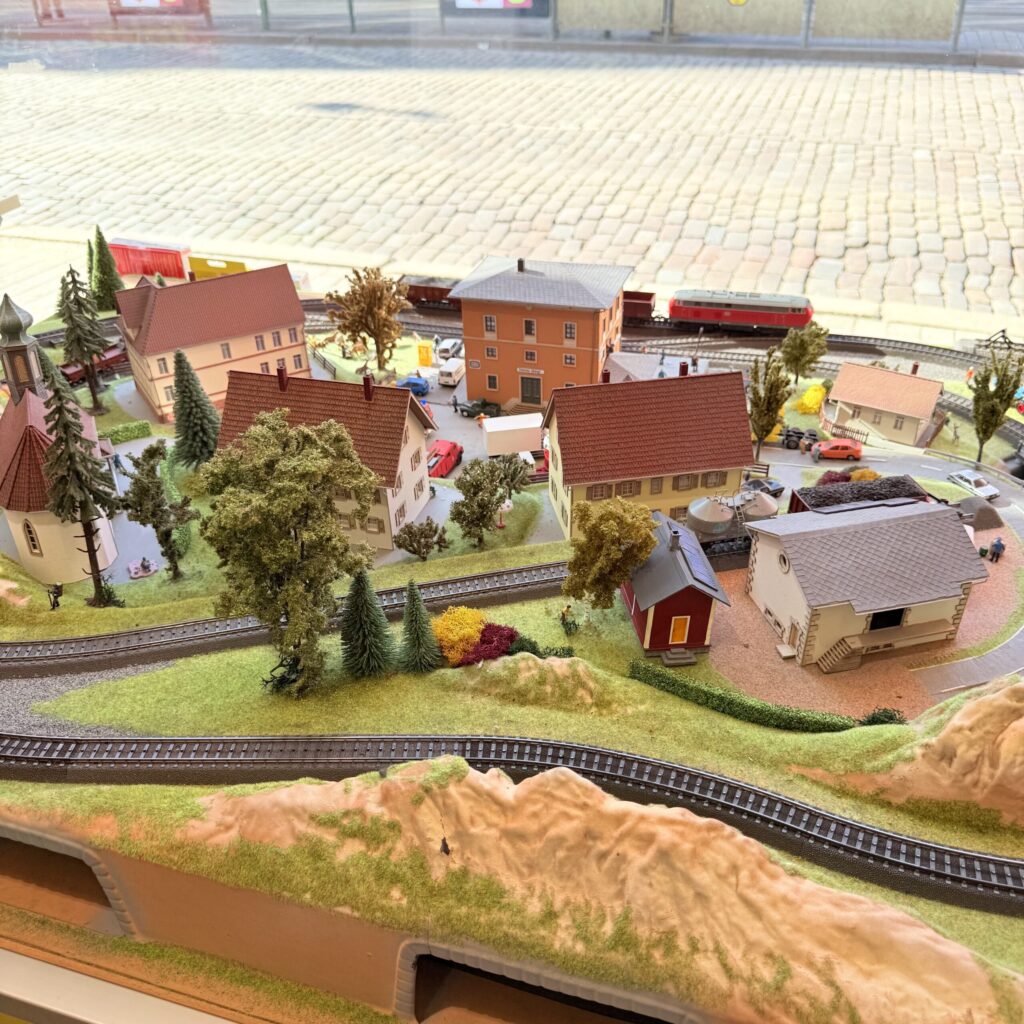 An elaborate HO gauge diorama displayed in the window of Hobby Point