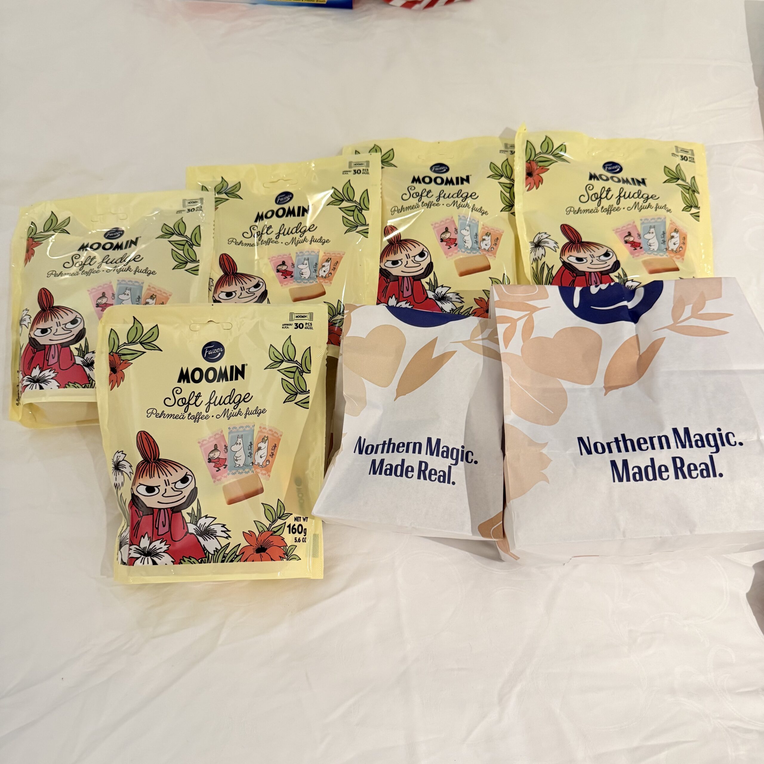 At the end of the day, laying out the loot on the fluffy white sheets is a blissful ritual. Today's main characters are the sweet temptations brought back from Fazer Café.