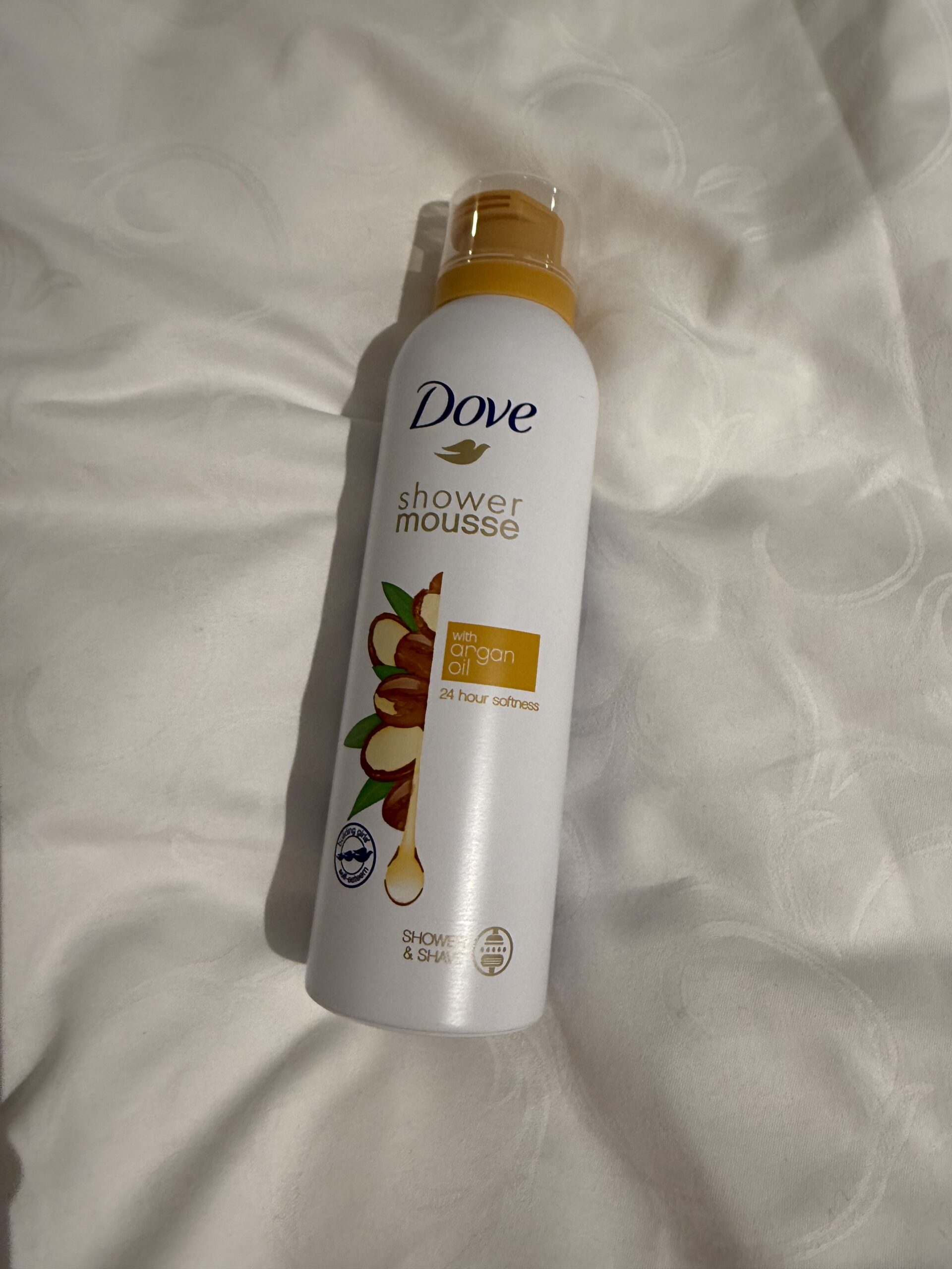 A Dove shower mousse rolled casually onto the bed of the accommodation.