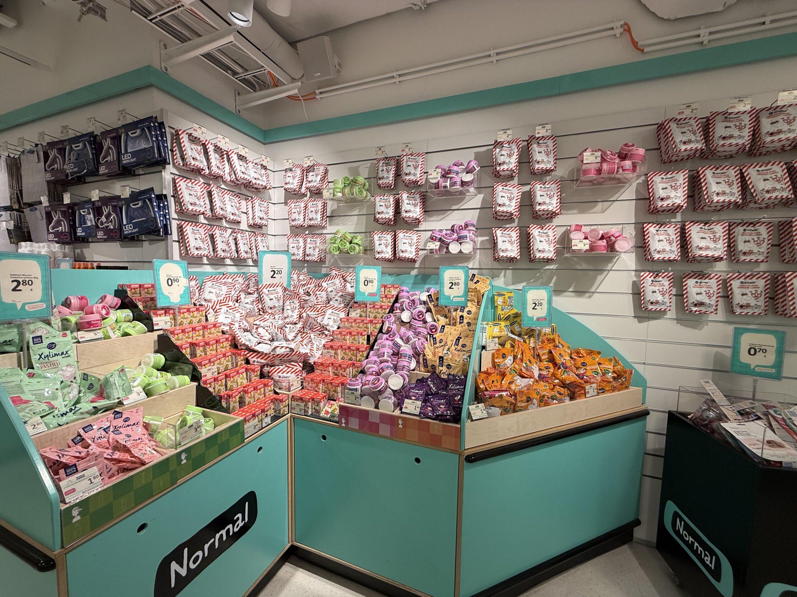 Colorful products like Xylimax on mint green shelves