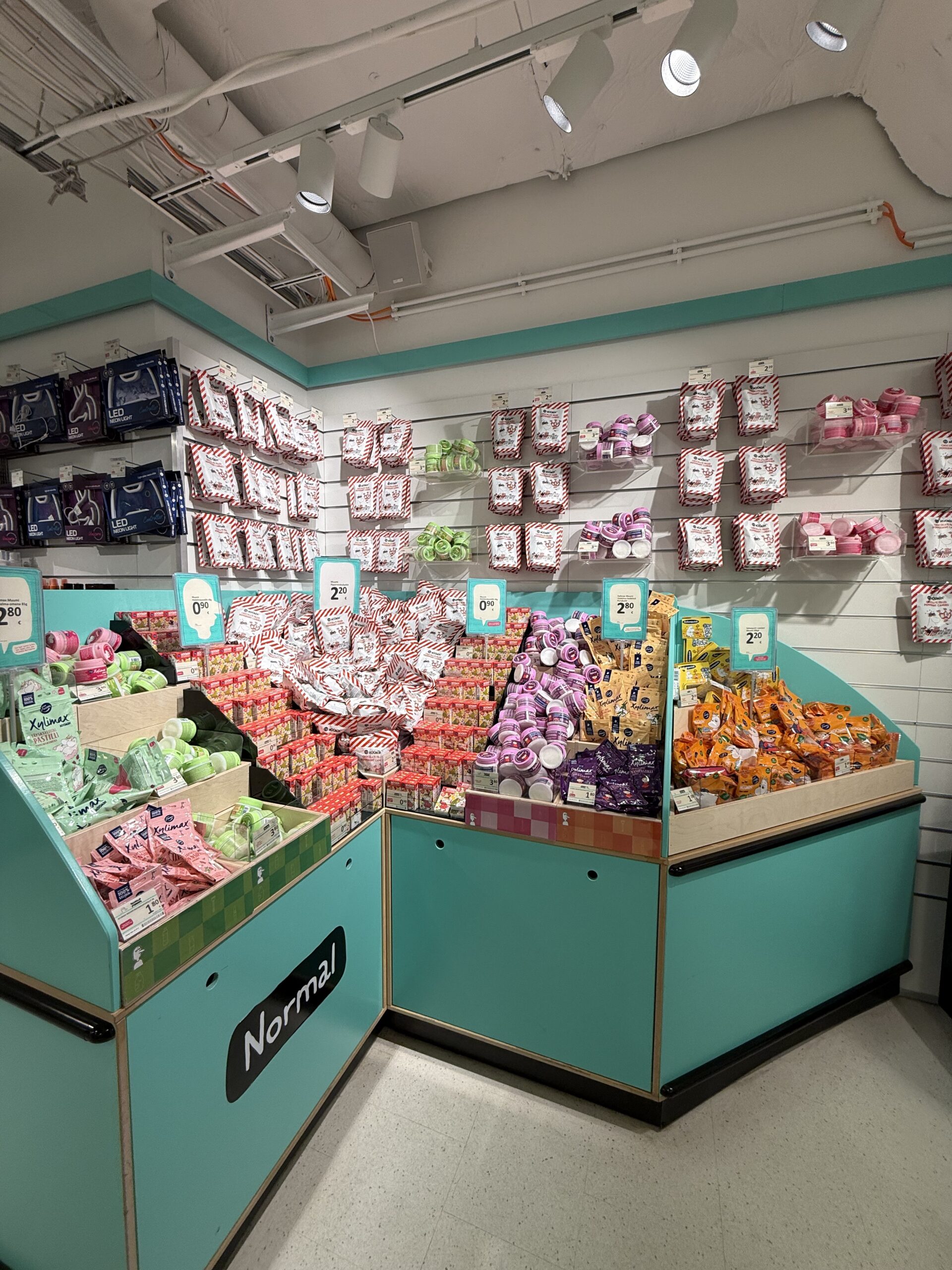 Mint green shelves packed with Marianne and Moomin sweets